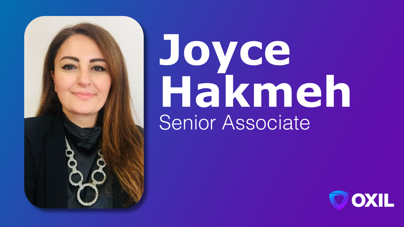 Gemini said An image featuring a professional headshot of Joyce Hakmeh, a Senior Associate at OXIL. On the left side of the image, there is a portrait of Joyce, a woman with long brown hair, wearing a black top and a silver necklace with large circular links. The background of the portrait is white. To the right of the portrait, on a blue and purple gradient background, is the text "Joyce Hakmeh" in large white bold letters, and below it, "Senior Associate" in a smaller white font. In the bottom right corner, there is a logo for OXIL.