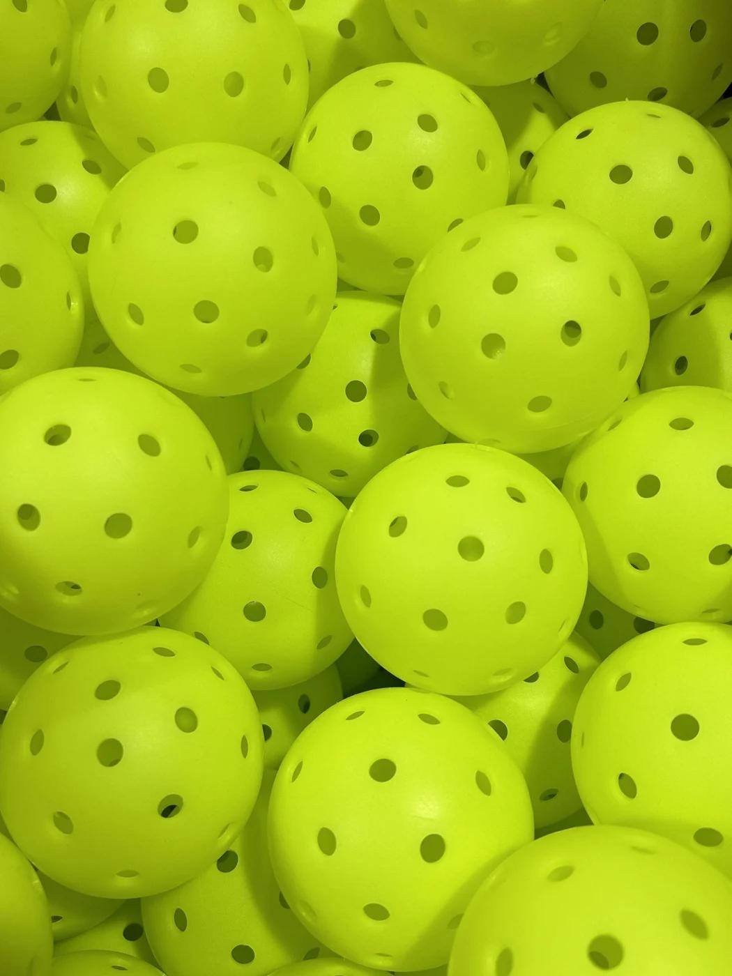 Loose yellow perforated balls in the supplied project image