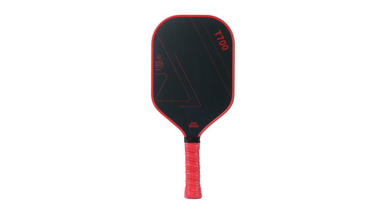 Black pickleball paddle with the model name T700 printed directly on the carbon face above a red grip, illustrating the permanently marked model designation that certification requires
