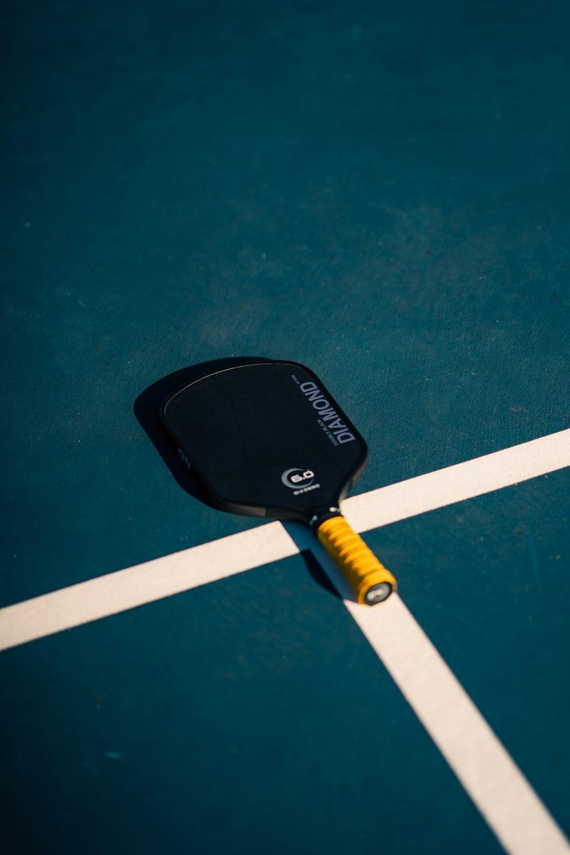 Professional photography representing Pickleball Paddle Defects: 23 OEMs Exposed, high quality, no text