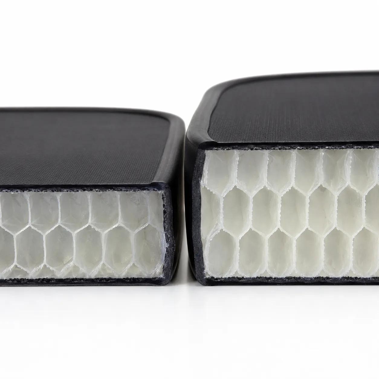 Hyper-realistic product photography, cross-section of two pickleball paddle cores, 14mm and 16mm polypropylene honeycomb, side-by-side comparison on a clean white surface, bright studio lighting, extreme macro detail of cell structure, no text, no brand logo