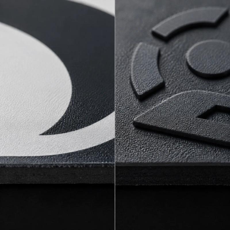 Split macro view of two pickleball paddle faces, a flat printed graphic on a textured face beside a raised moulded graphic on a textured face