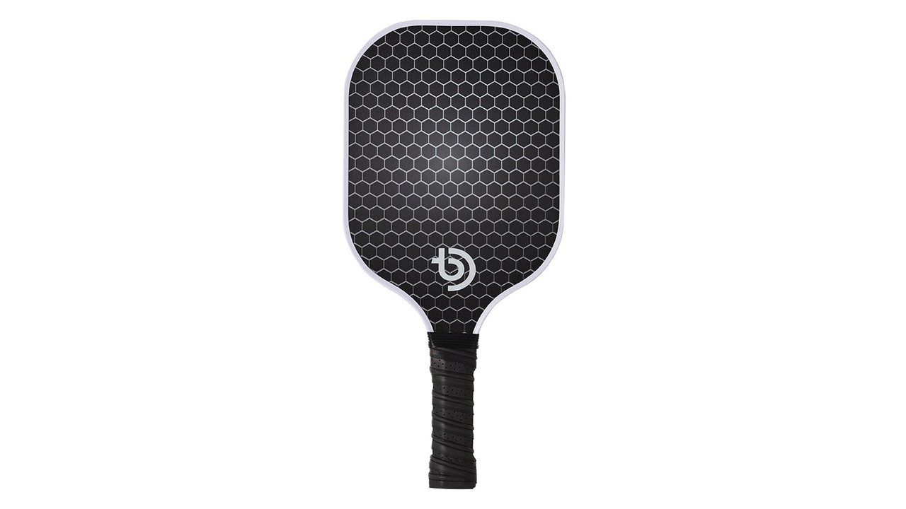 Golden sample pickleball paddle on a white studio background