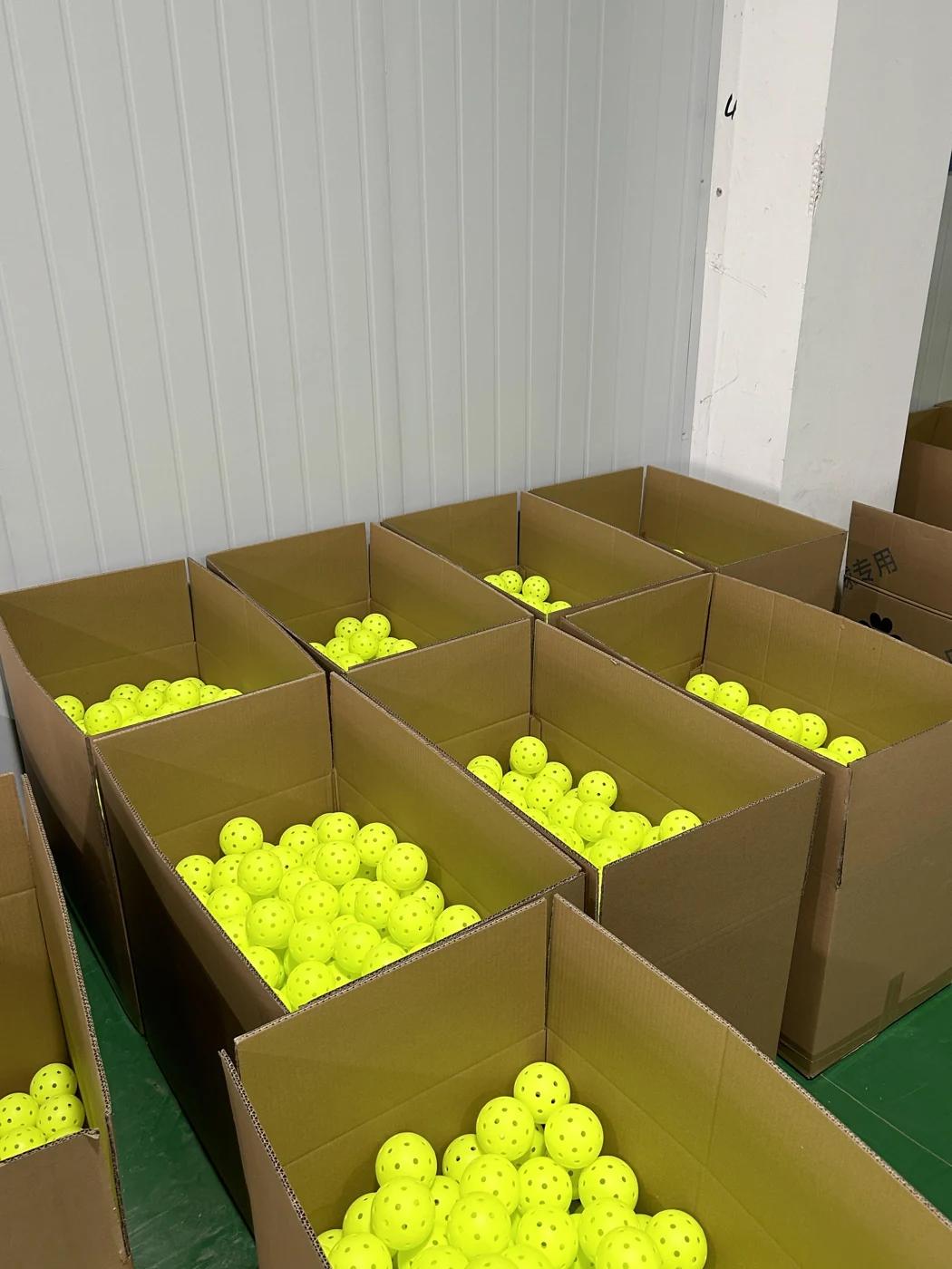 Yellow balls in open stock cartons