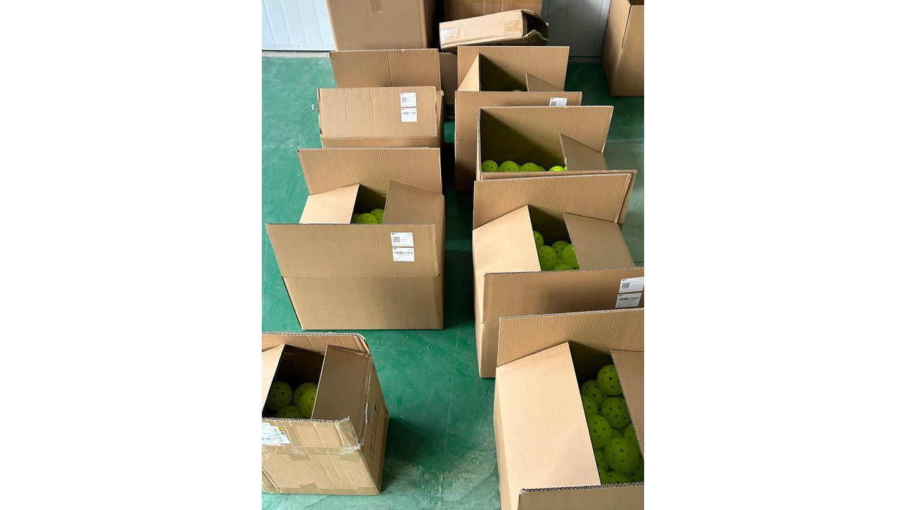 Pre-shipment cartons palletized and labelled for a pickleball facility opening delivery