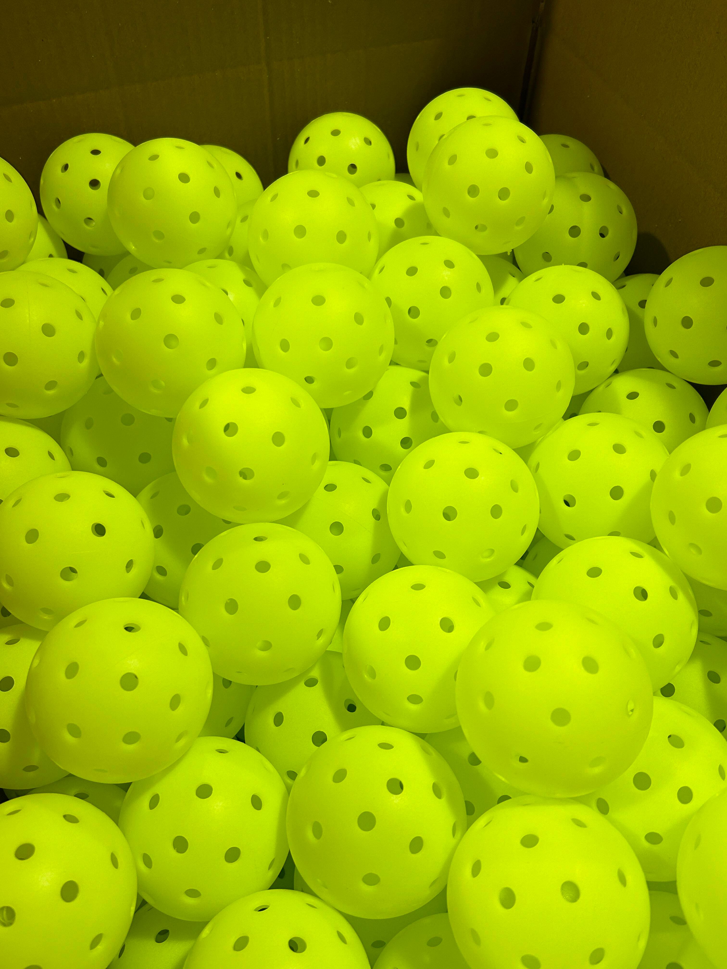 A batch of high-visibility pickleballs suitable for school and rec program bulk purchase