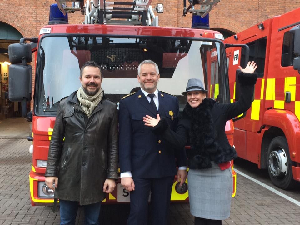 The band in front of a firetruck