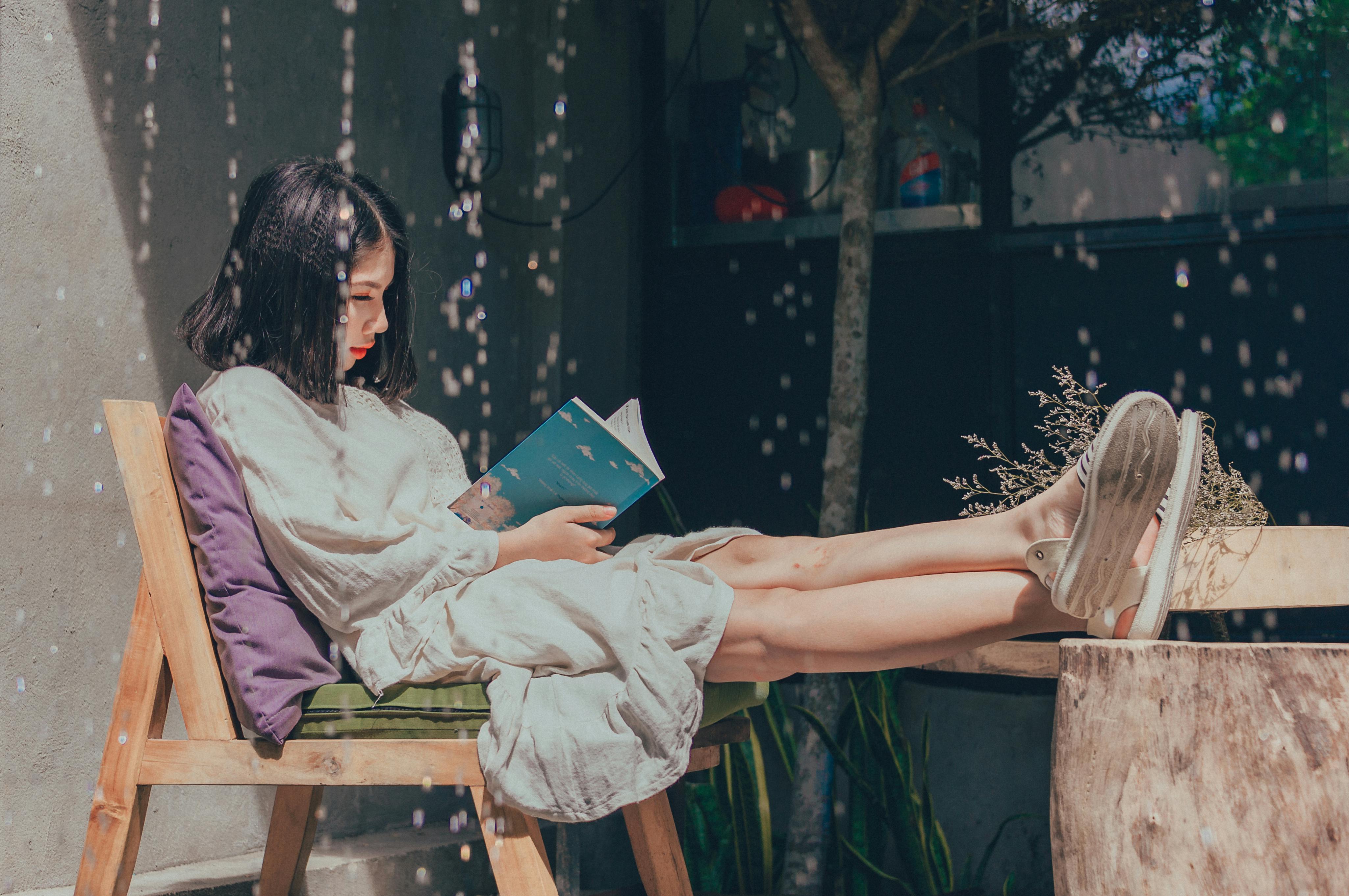 the girl is reading a book