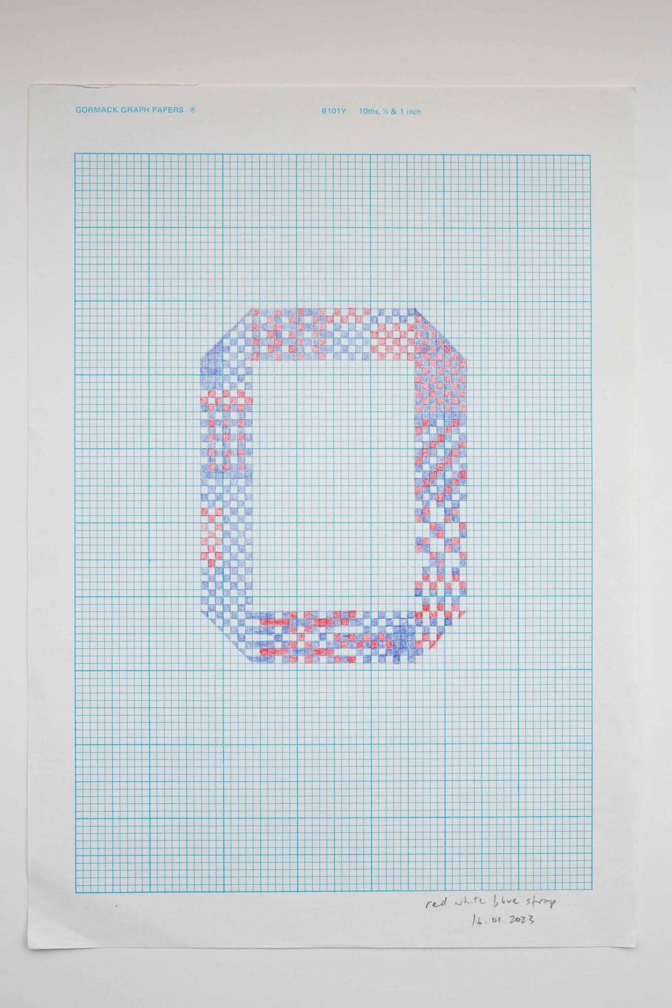 Graph paper with a strap pattern planned out on it in red and blue pencil