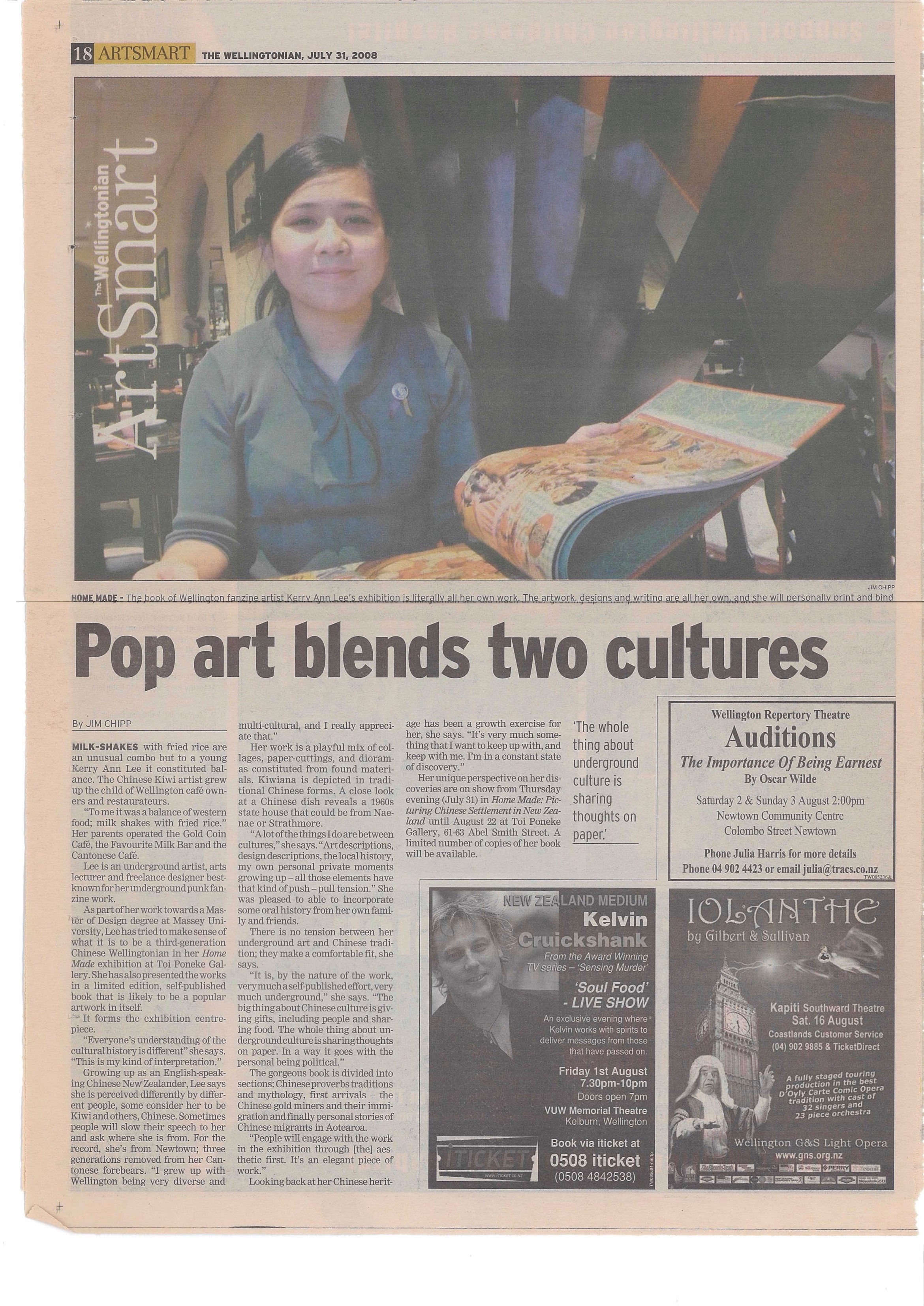Newspaper article with a photo of Kerry Ann Lee looking at her artist book