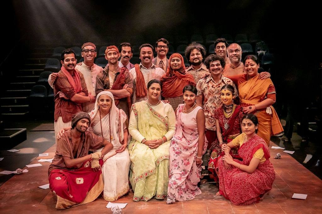 Photo of a theatre cast standing together