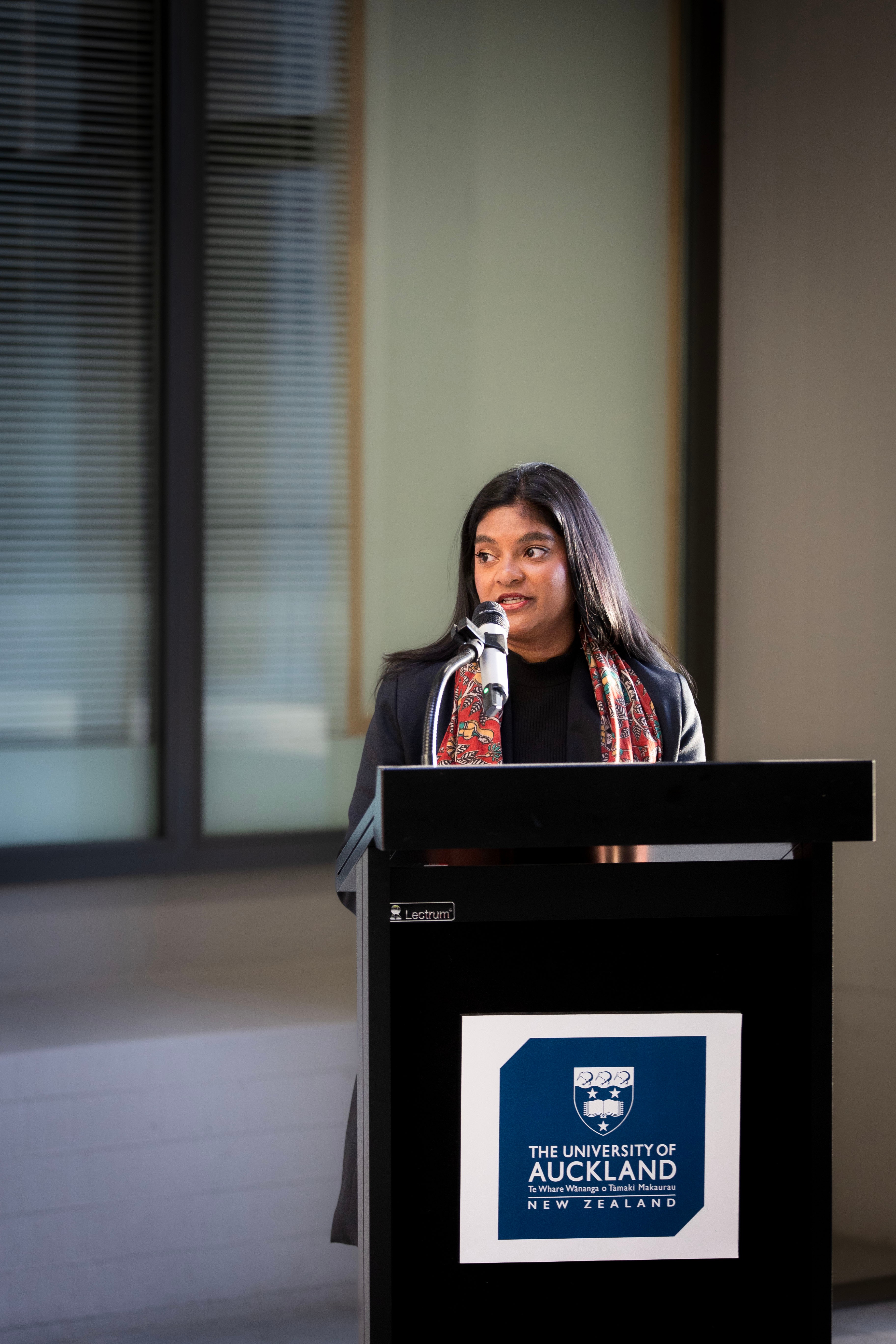 A person speaking at a podium