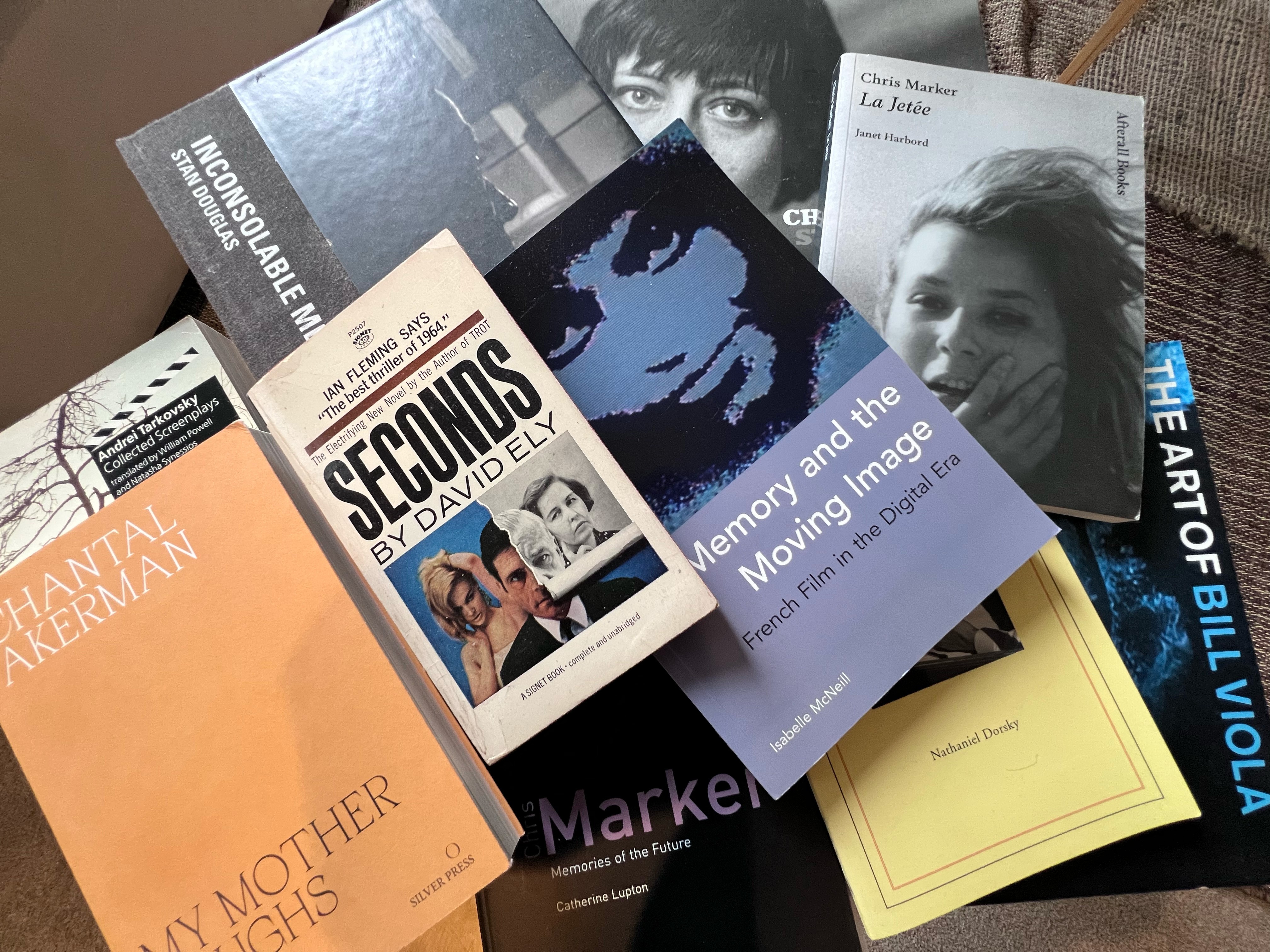 A pile of books on cinema, on filmmakers including Chantal Akerman, Andrei Tarkovsky and Chris Marker.