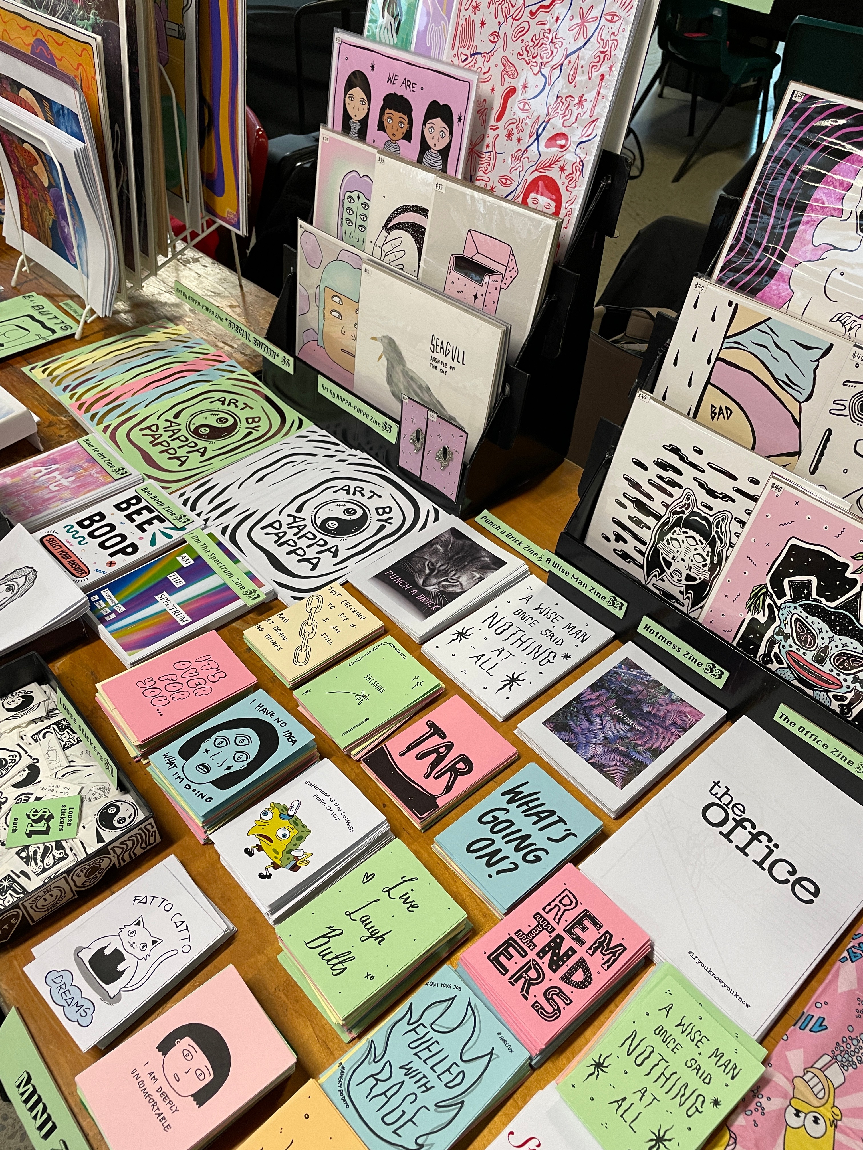 Several zines displayed on a table
