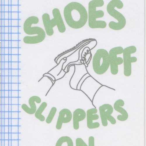 Shoes Off Slippers On in large green text with a black and white illustration of a hand taking off a shoe and blue simple tartan along the left margin.