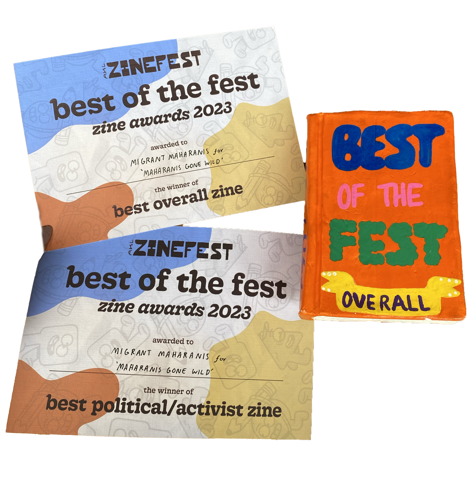 Two certificates and a trophy in the shape of a book that says "Best of the Fest Overall" 