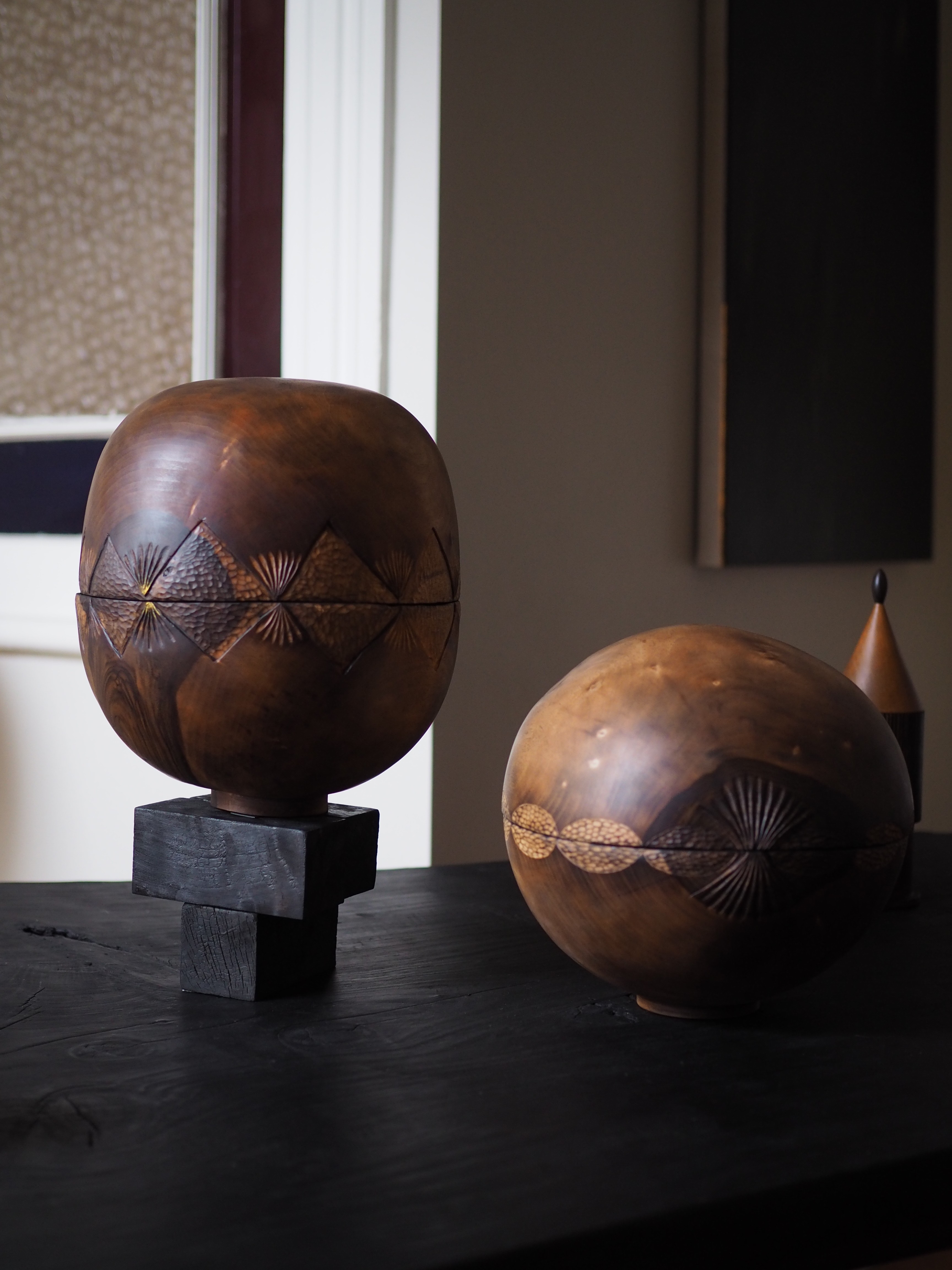 Two rounded wooden objects 