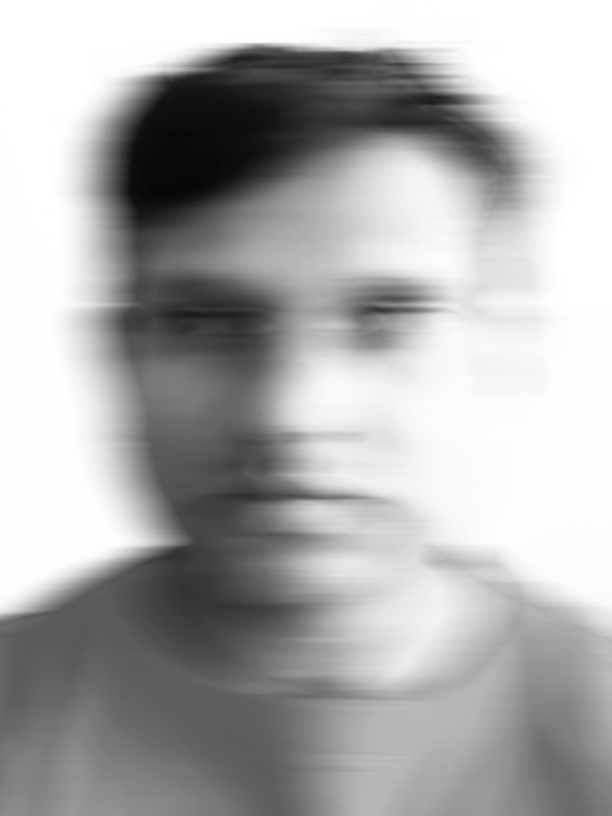A blurry black and white portrait of a man