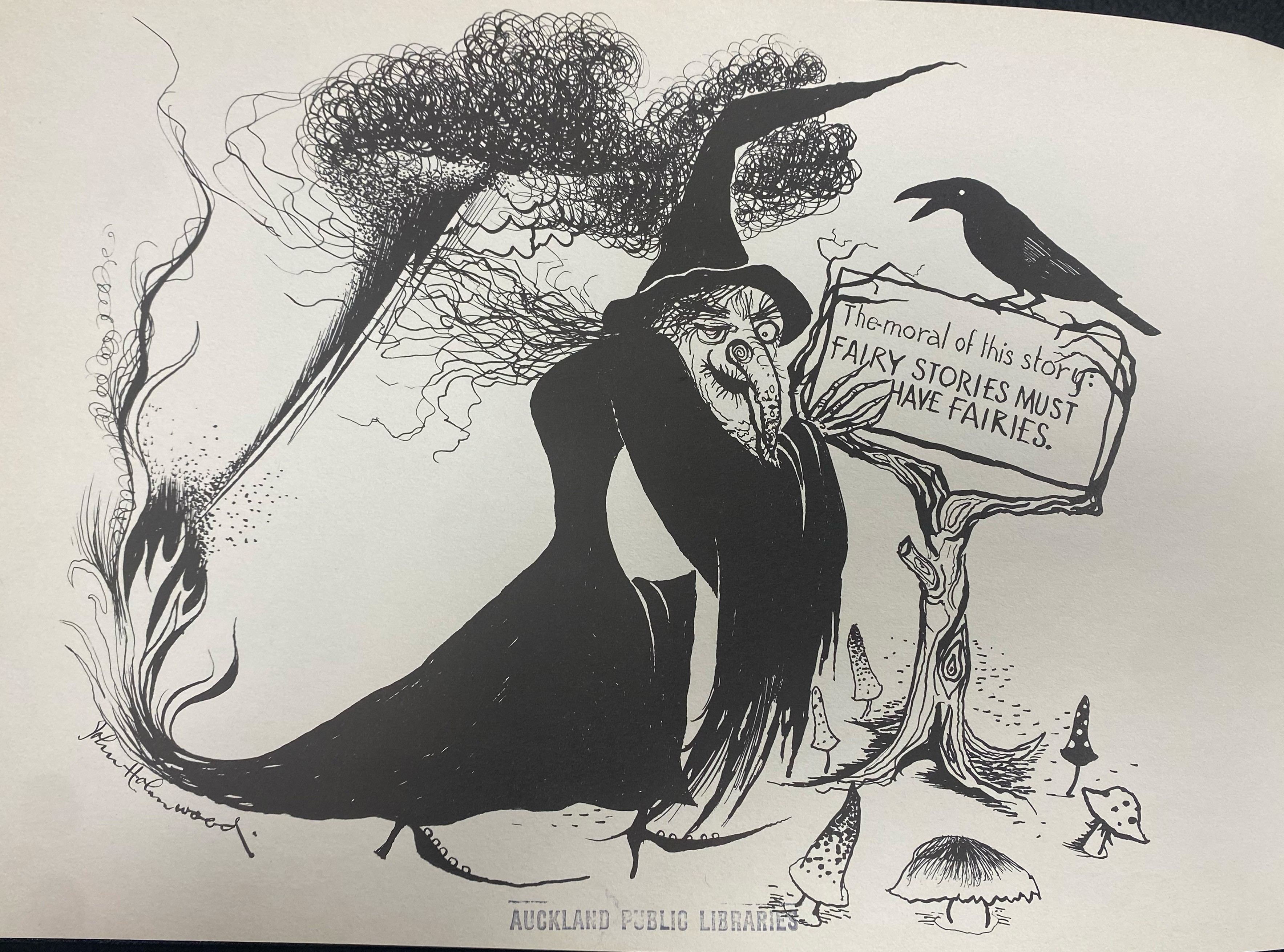 A illustration of a witch holding a sign