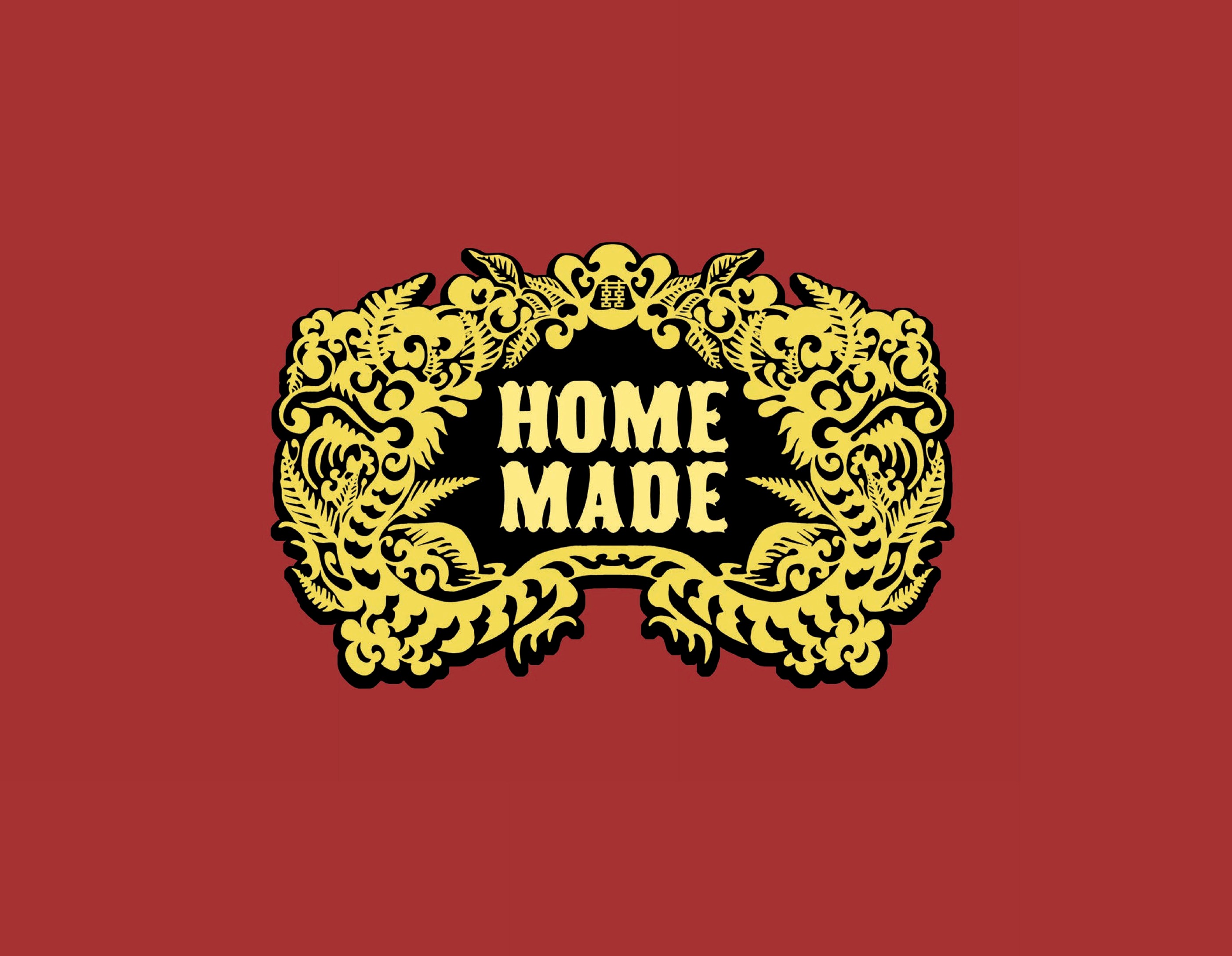 Red cover with the words 'Home Made' in yellow inside an ornate yellow and black Chinese dragon border