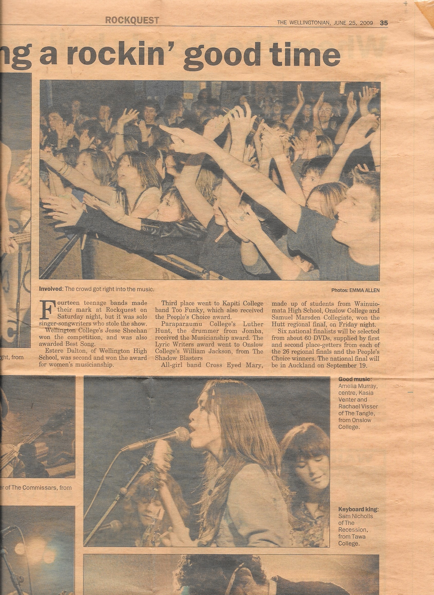 Yellowed newspaper clipping featuring photo of Amelia singing into mic