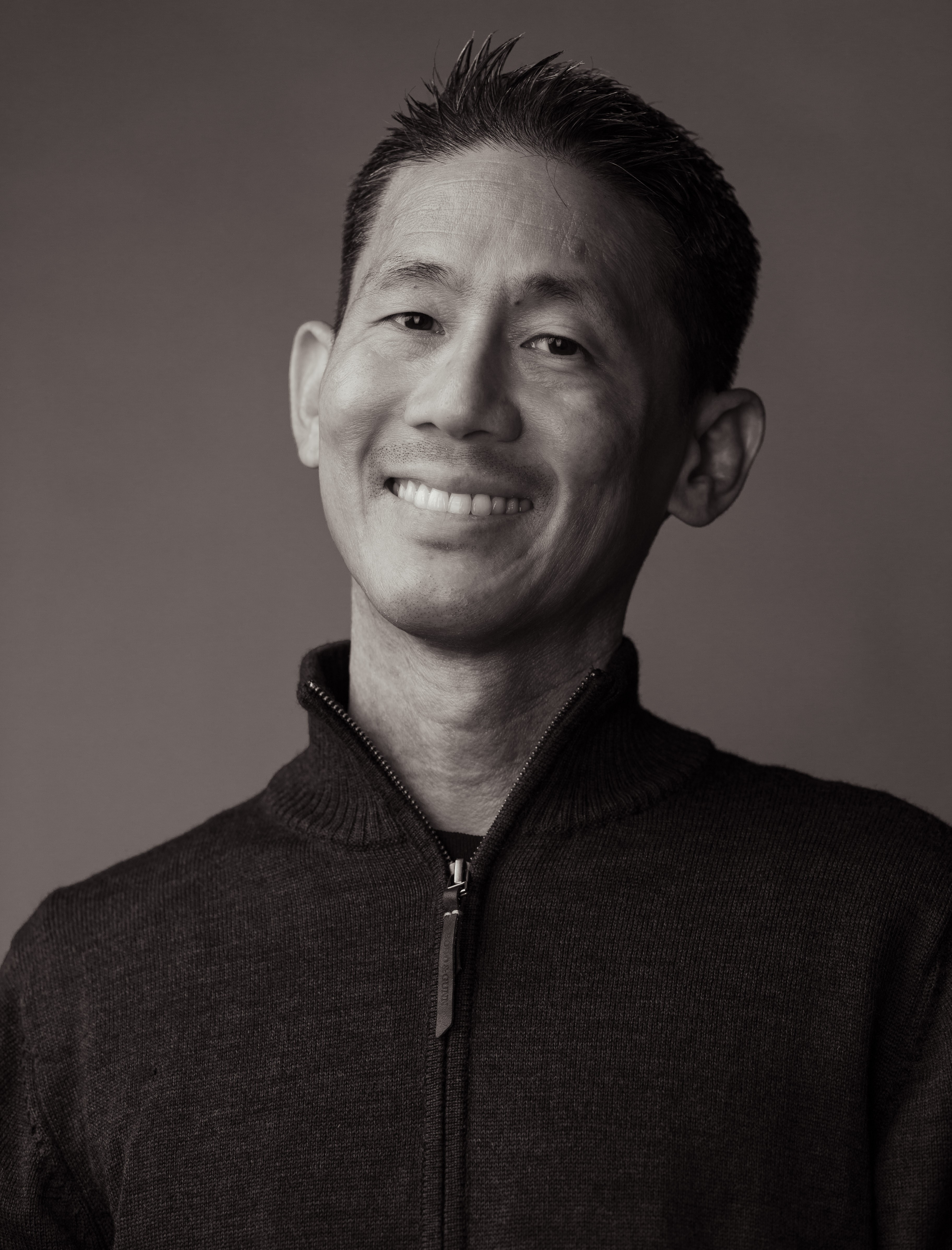 A black and white headshot of Steven Chow.