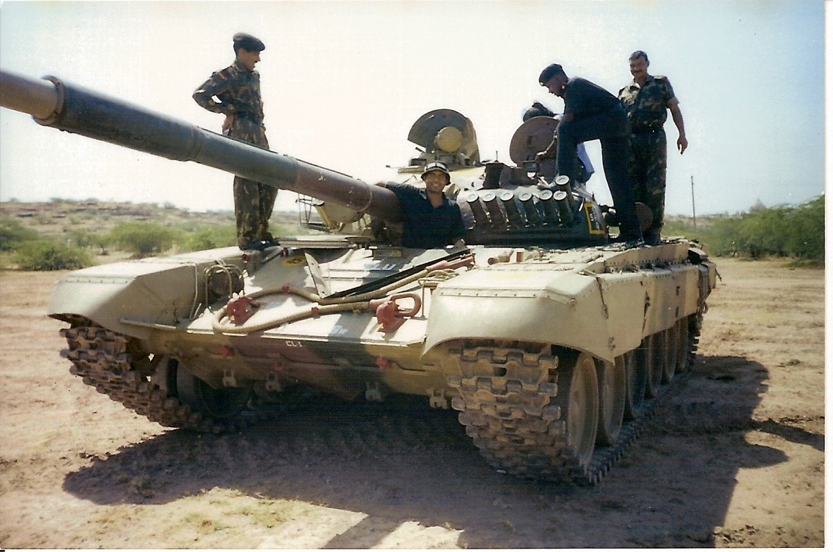 Men in army uniform on a tank