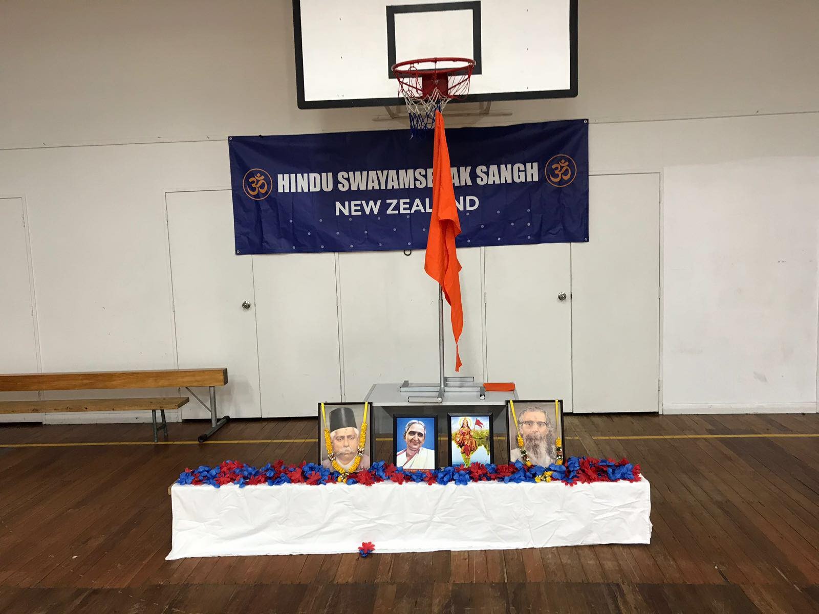 A display of portraits with garlands.