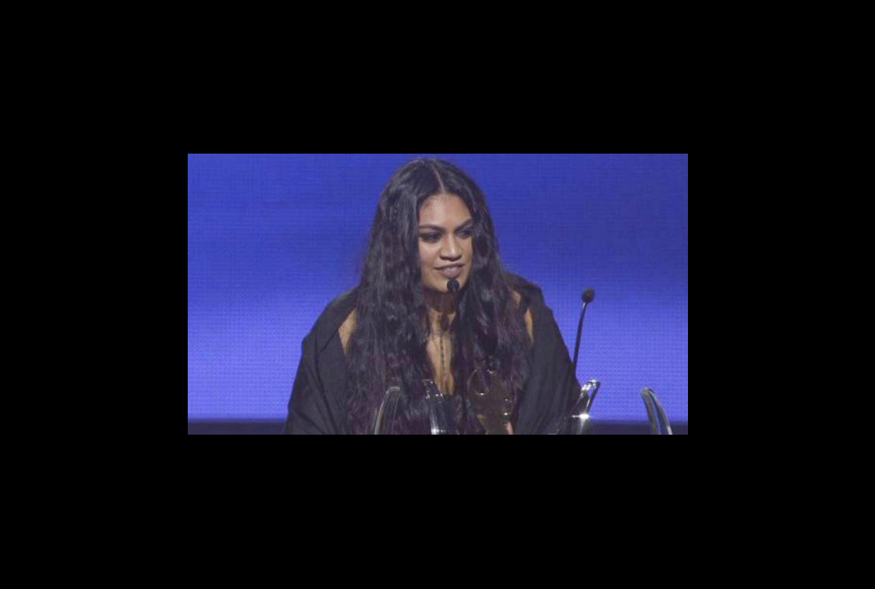 Screen grab of Aaradhna giving a speech at an awards ceremony.