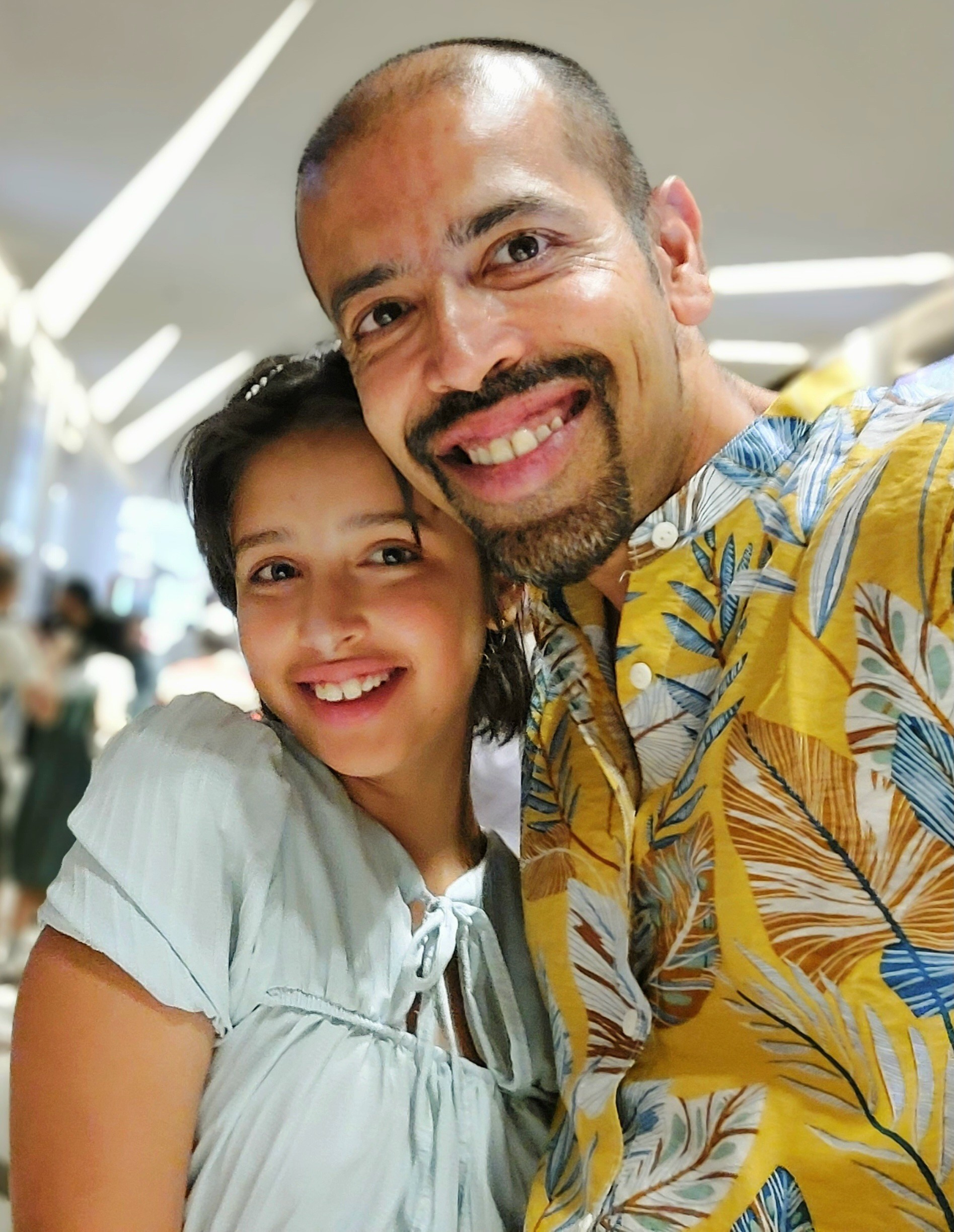 Two people standing together and smiling