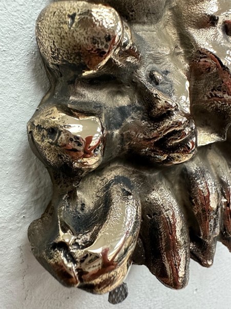 A close up of a metal sculptural object