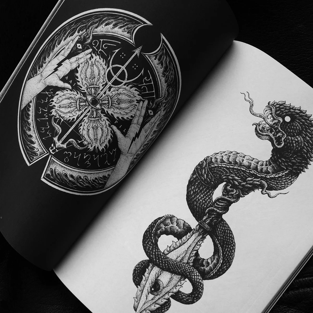 Page spreads of a zine featuring white abstract illustrations on black paper. The illustrations have a morbid tone to them.   