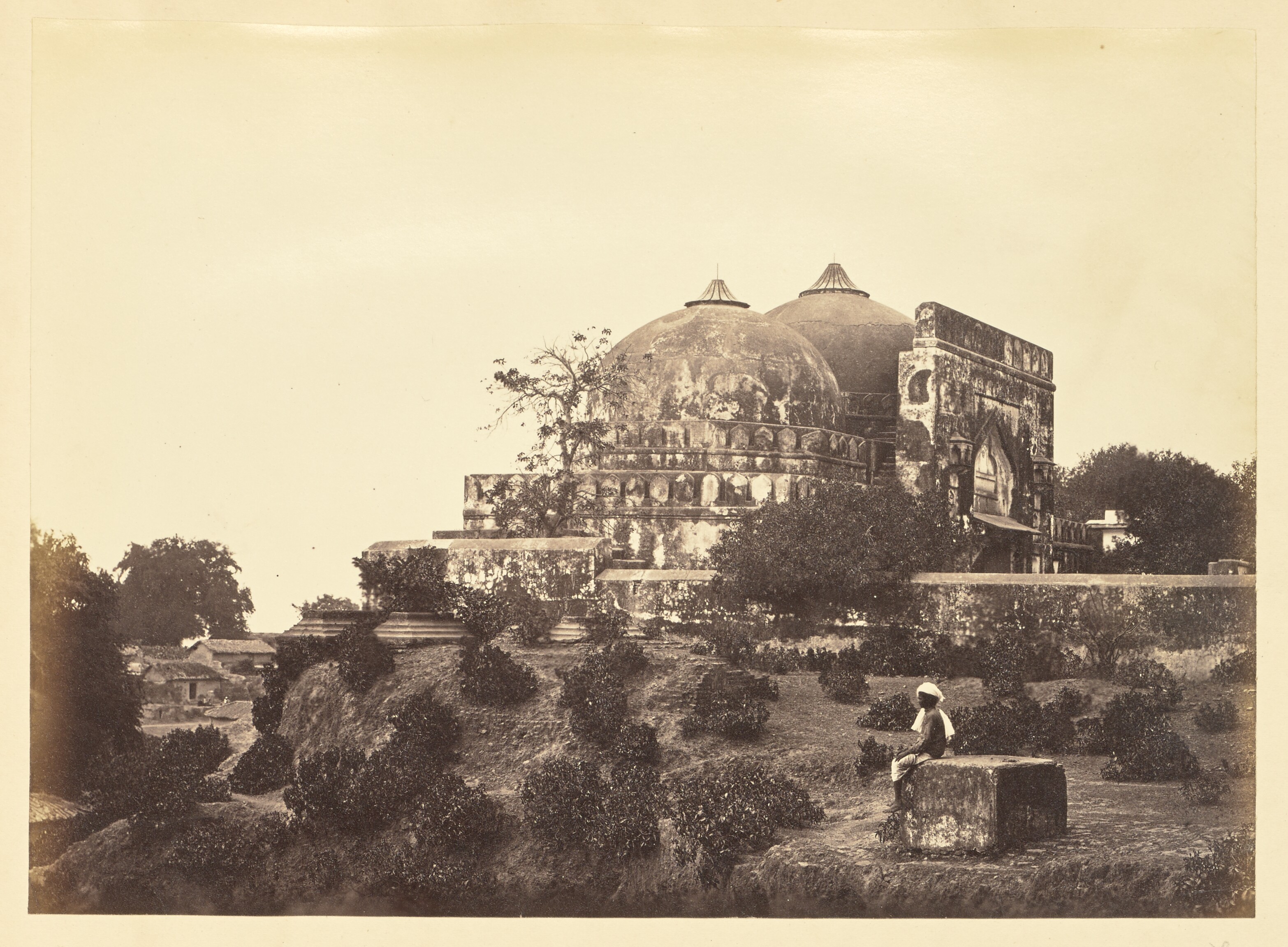 Archive photograph of a masjid against the sky.