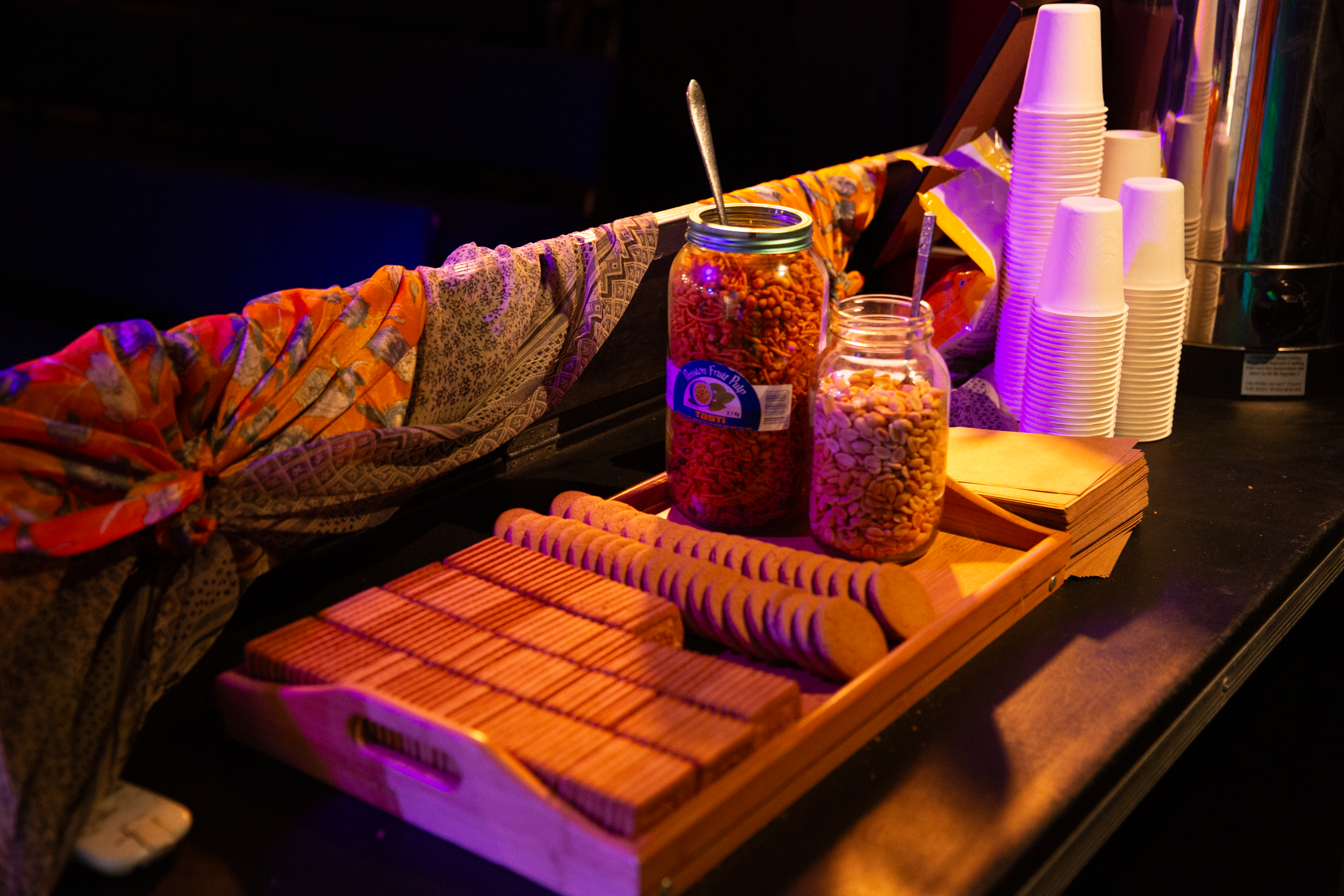 Biscuits, snacks, and cups on a table