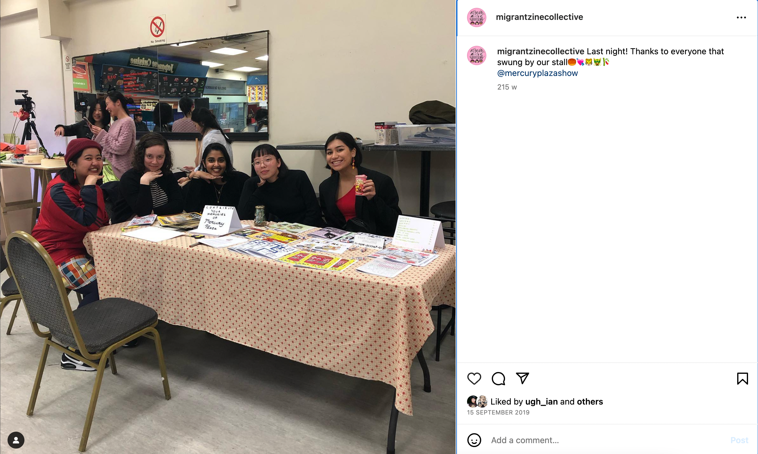 Five people smiling around a table displaying various zines displayed. 