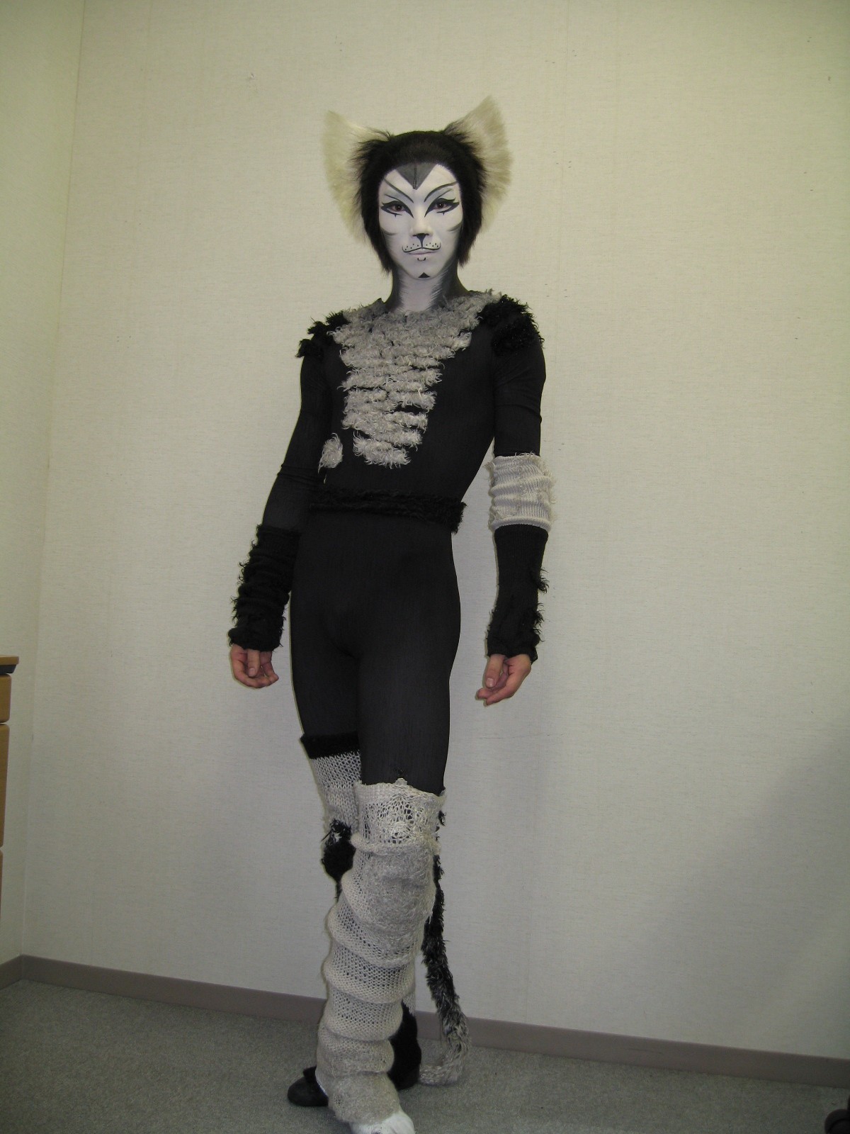 Dancer in a black and white cat costume.