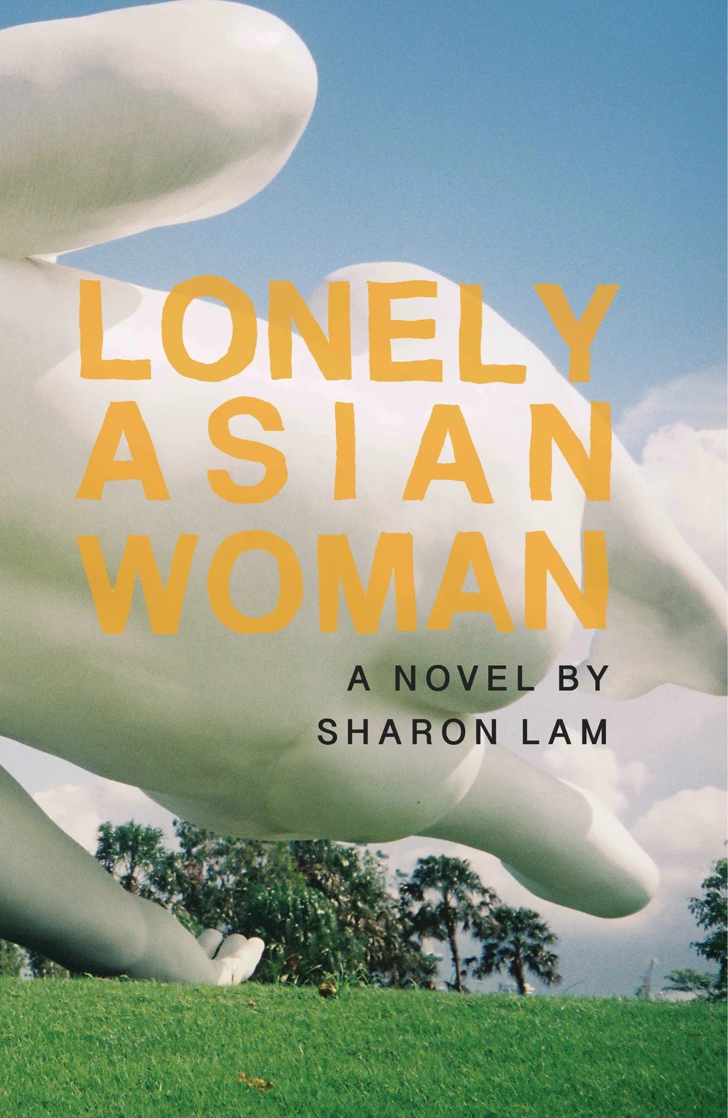 A large floating baby sculpture with the text 'LONELY ASIAN WOMAN' in yellow on the front