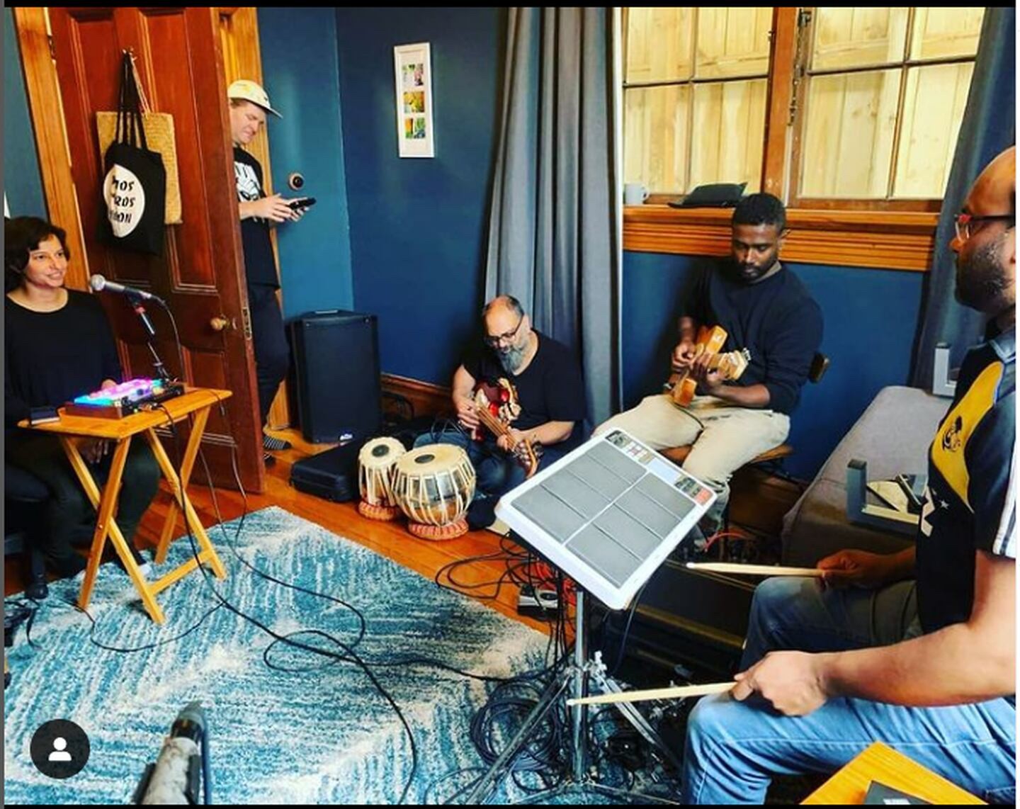 A group of South Asian musicians jamming.