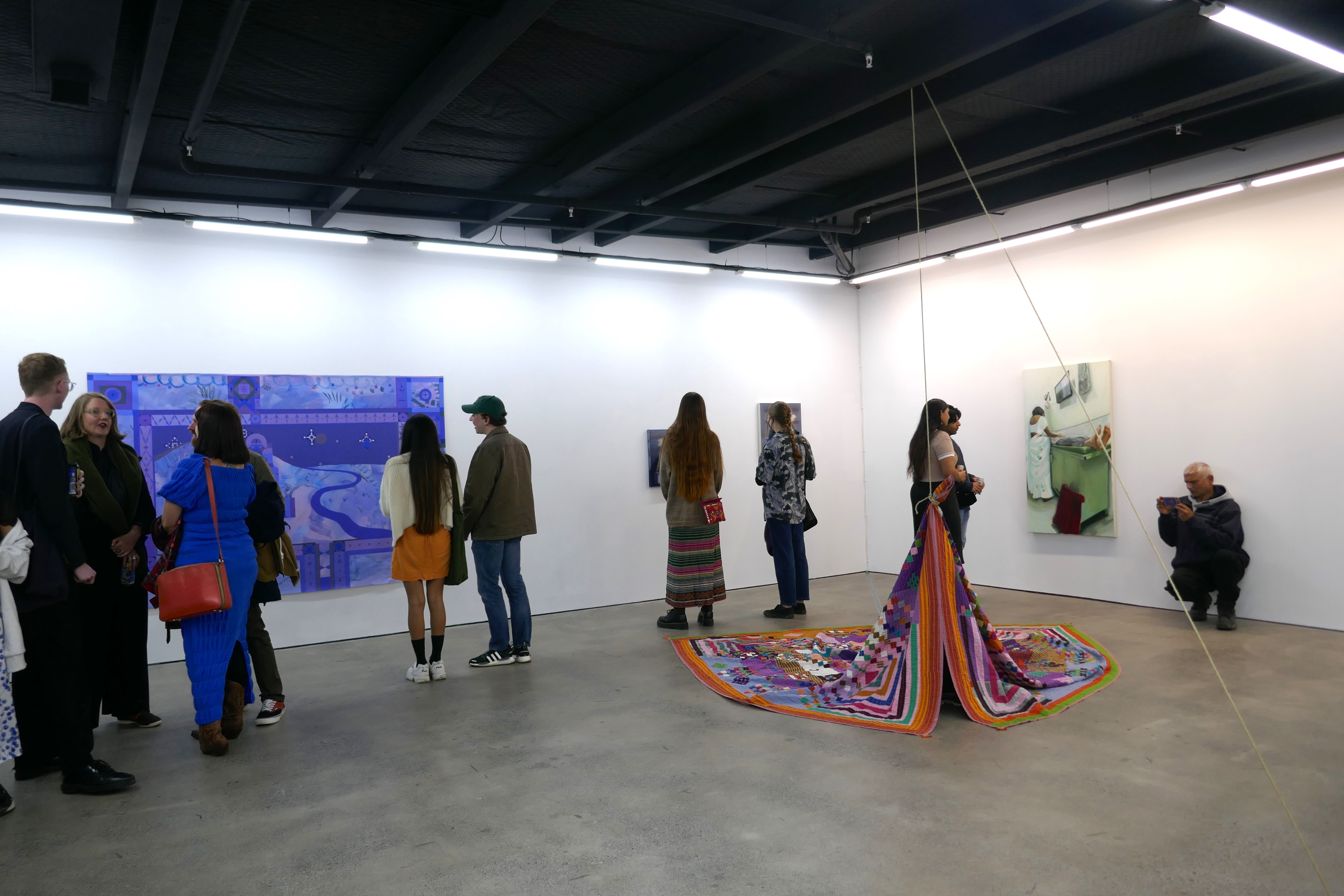 People viewing an art exhibition