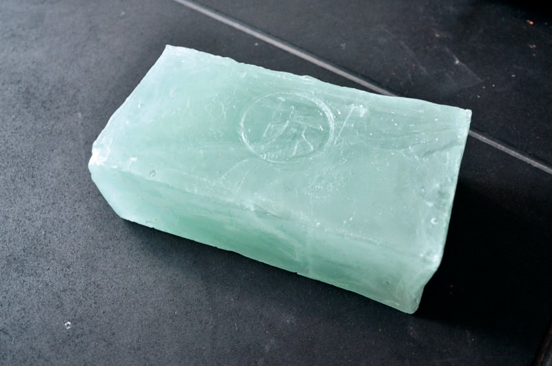 Photograph of a green-tinged glass brick.