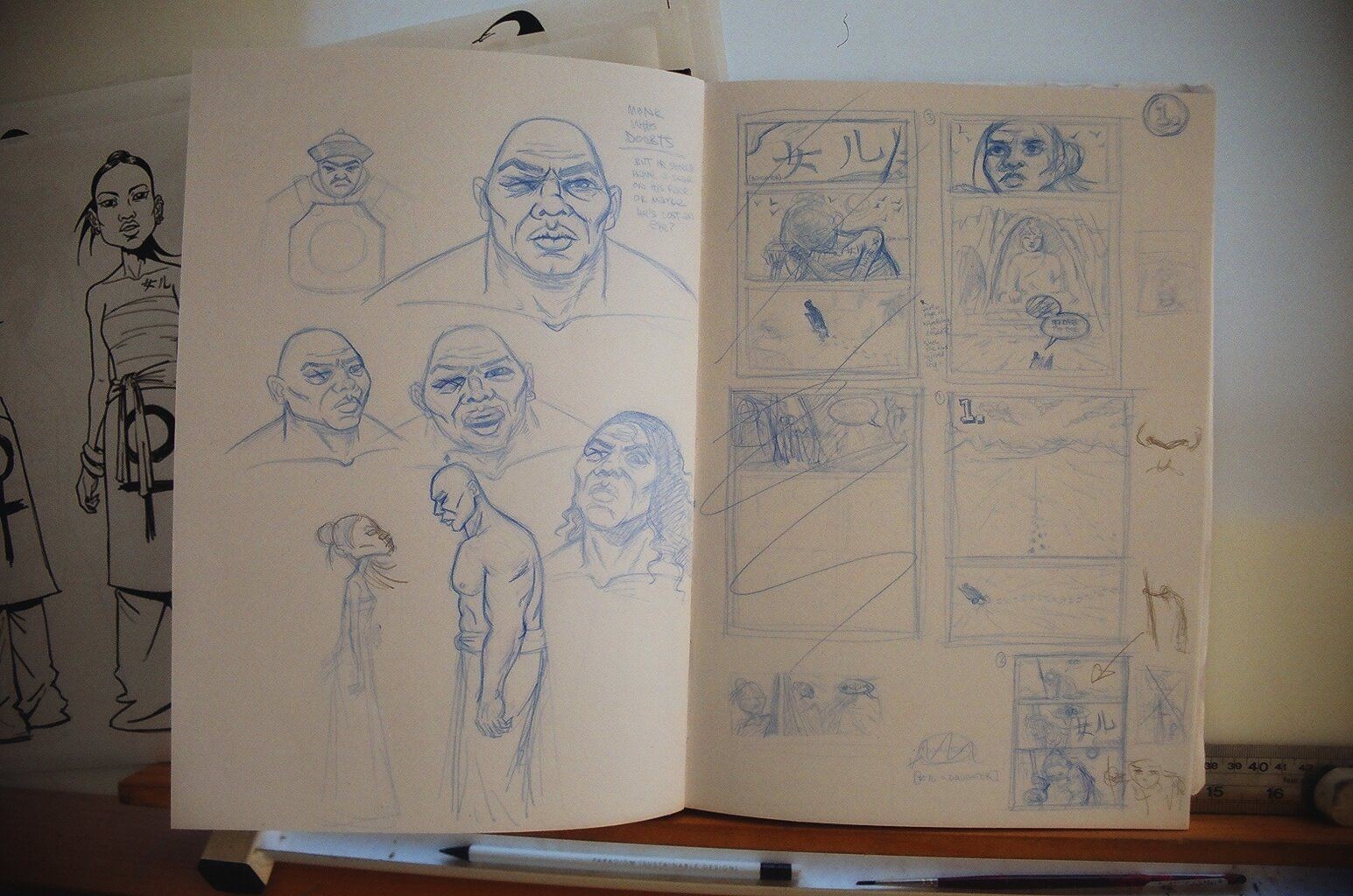 A sketchbook spread with drawings in blue pencil. 