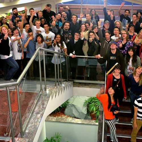 A crowd of about a hundred people gather on the stairway in the Aotea Centre.