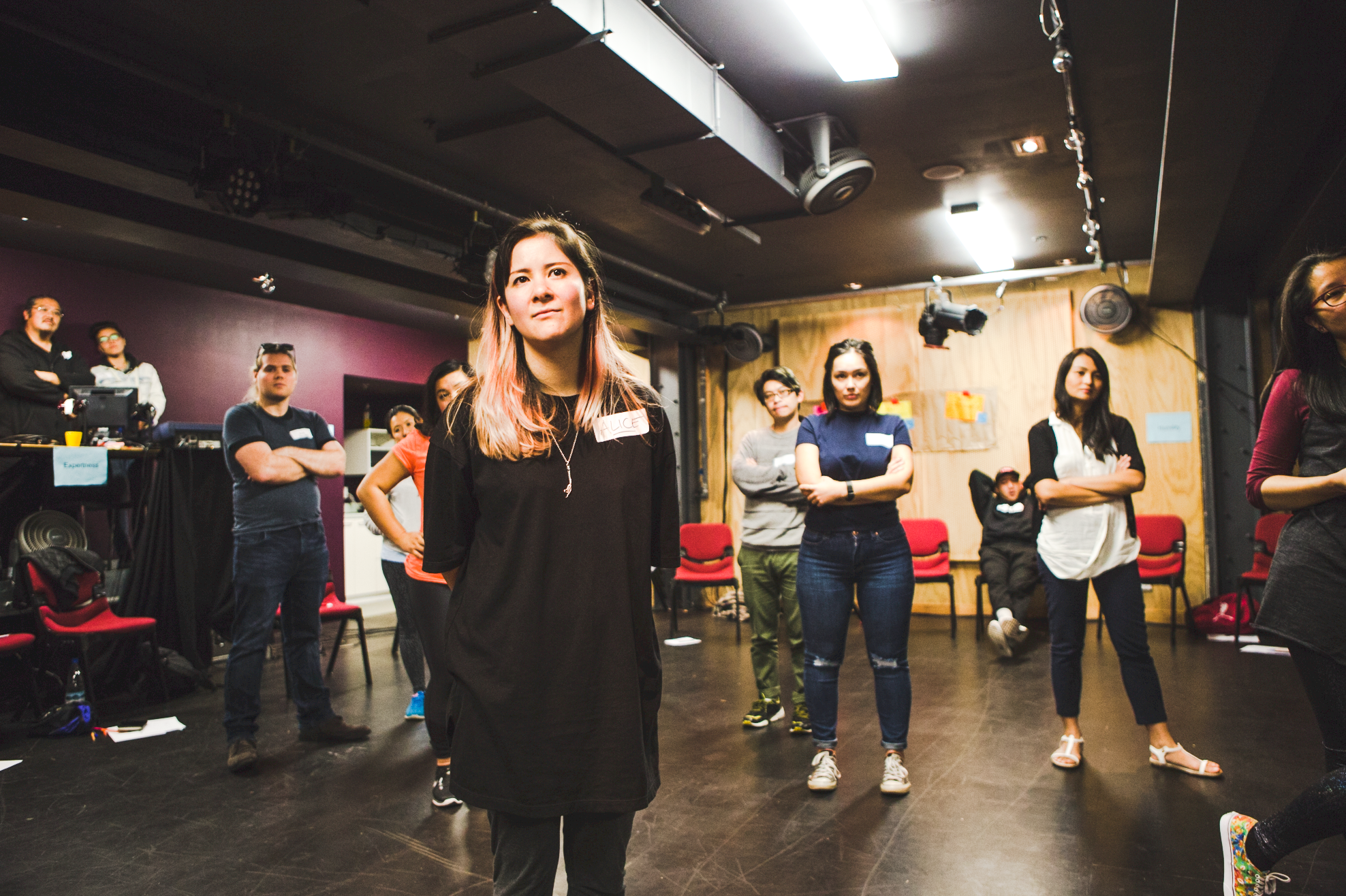 A group of people stare at a point beyond the camera