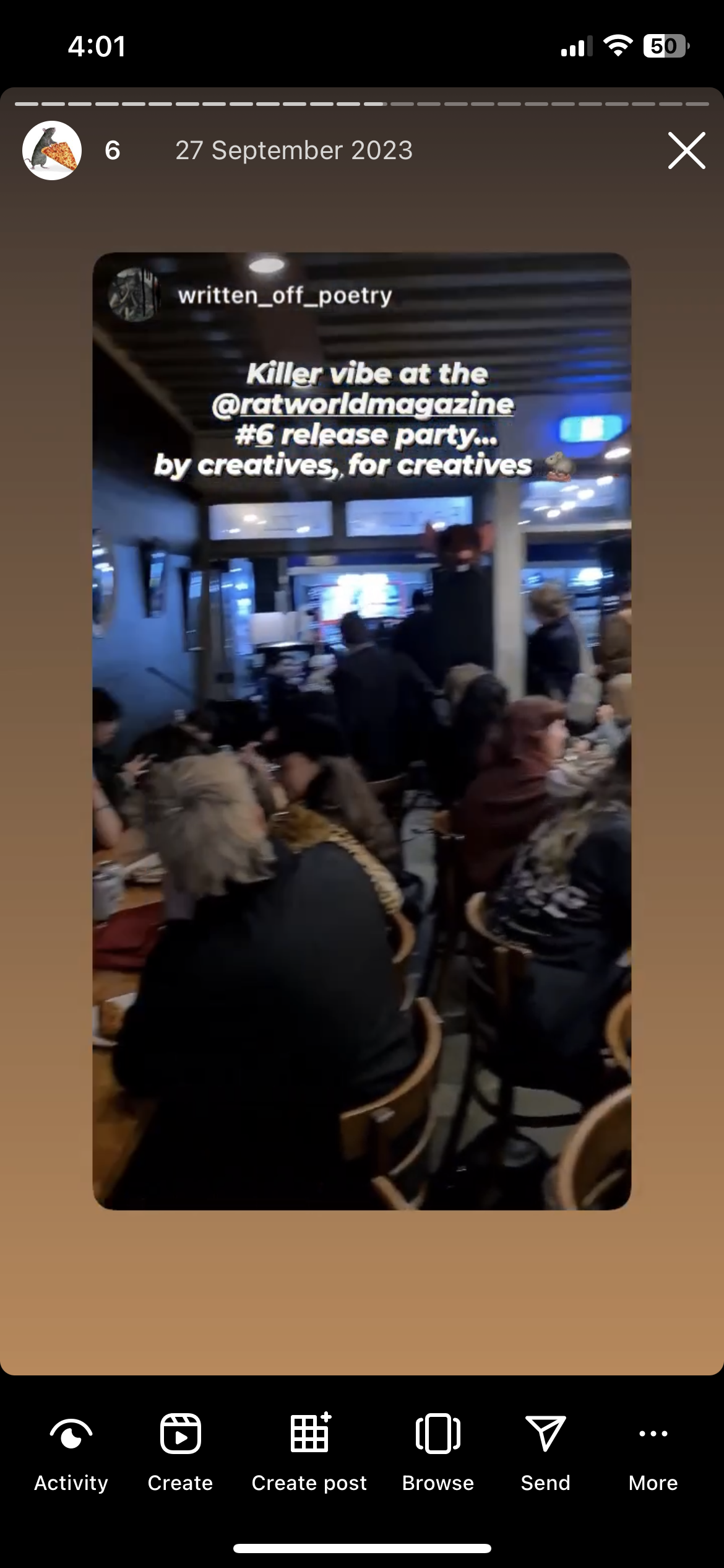 Screenshot of a social media story with a photo of people crowded into an event.