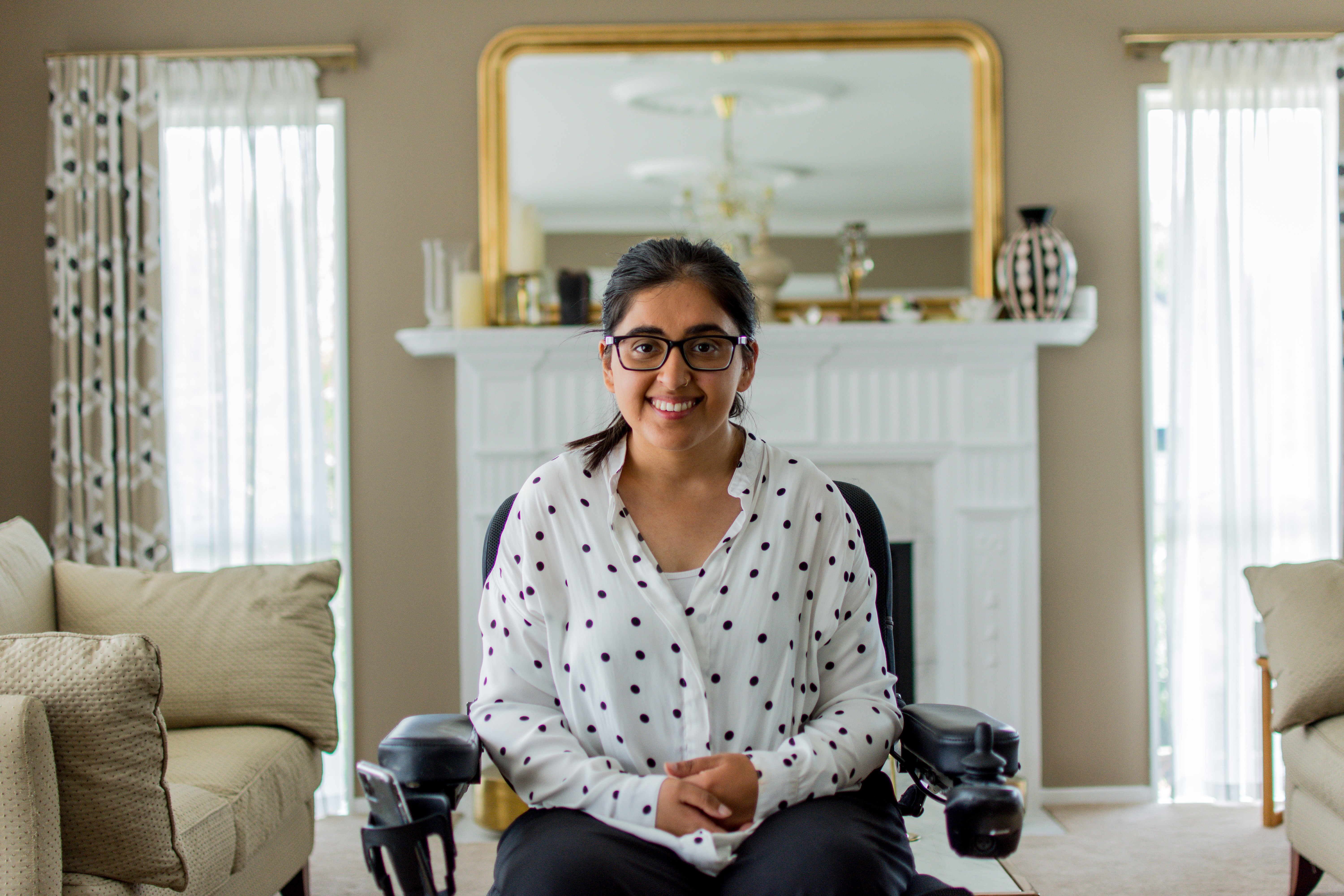 In a scene from 'This Is Us', a woman in a wheelchair is in her living room.