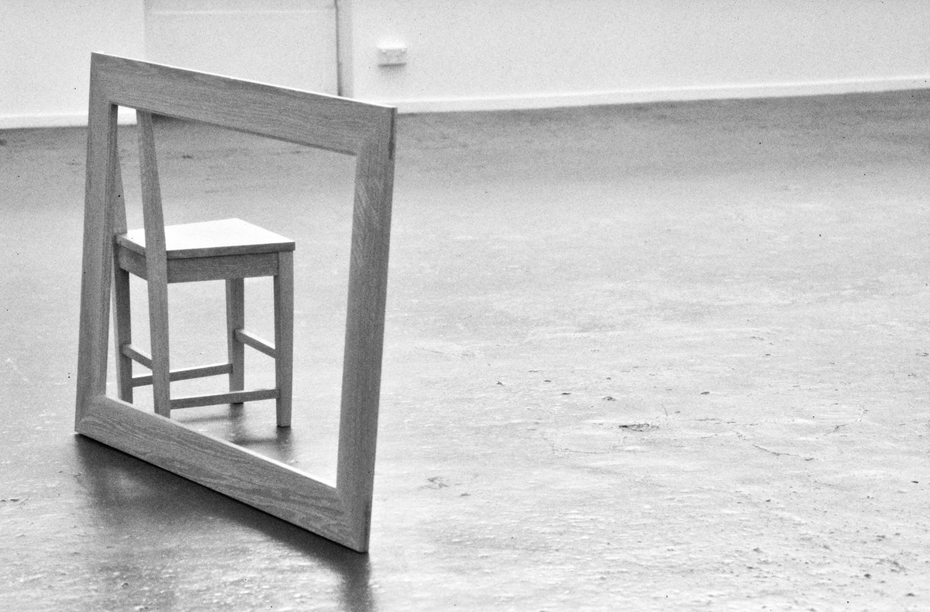 a frame leaning on a small stool