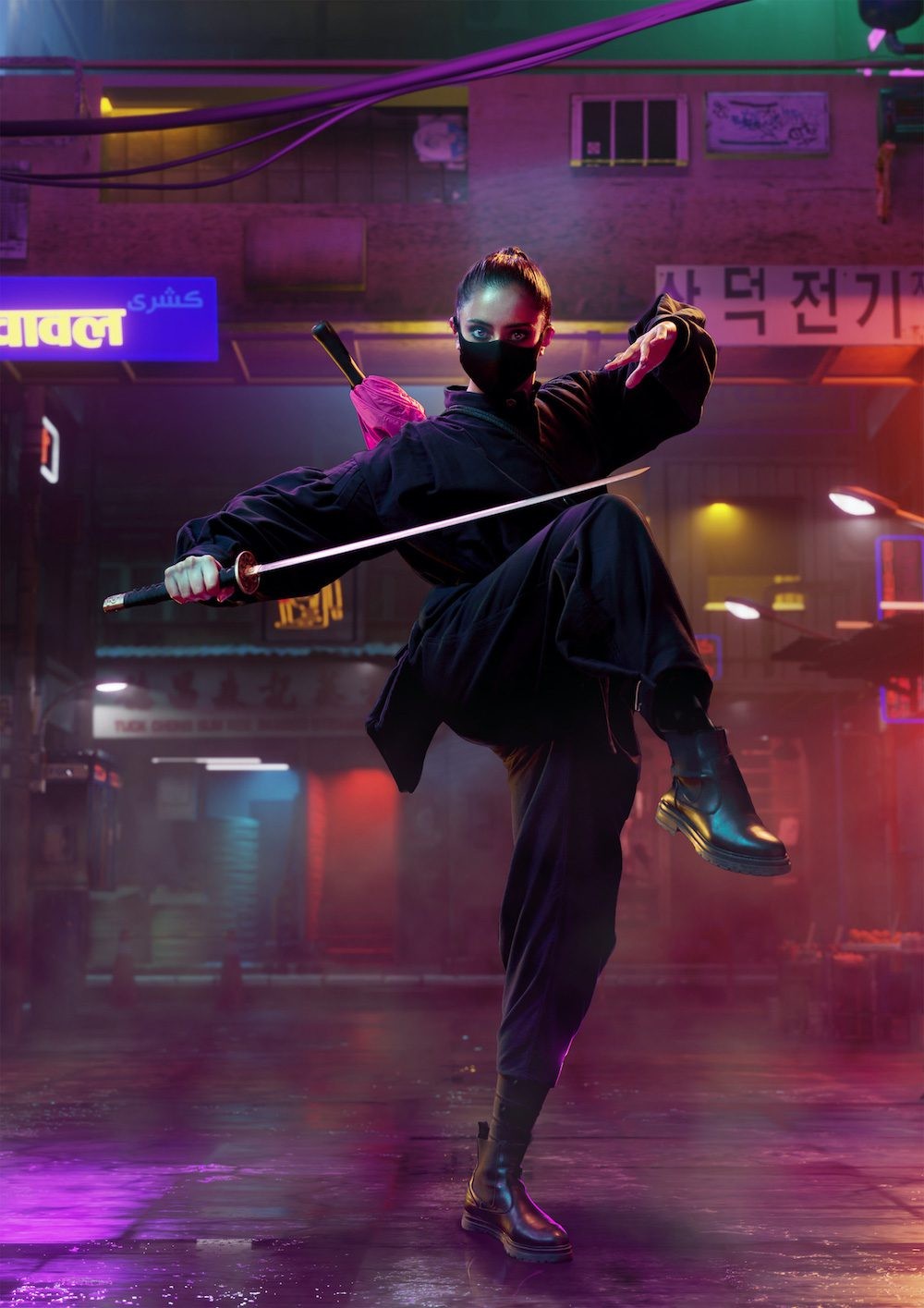A woman in black wielding a sword stands in a neon-coloured street