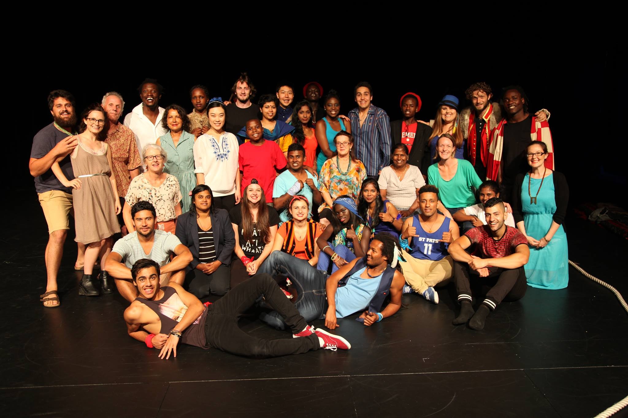 A group photo of people on a stage