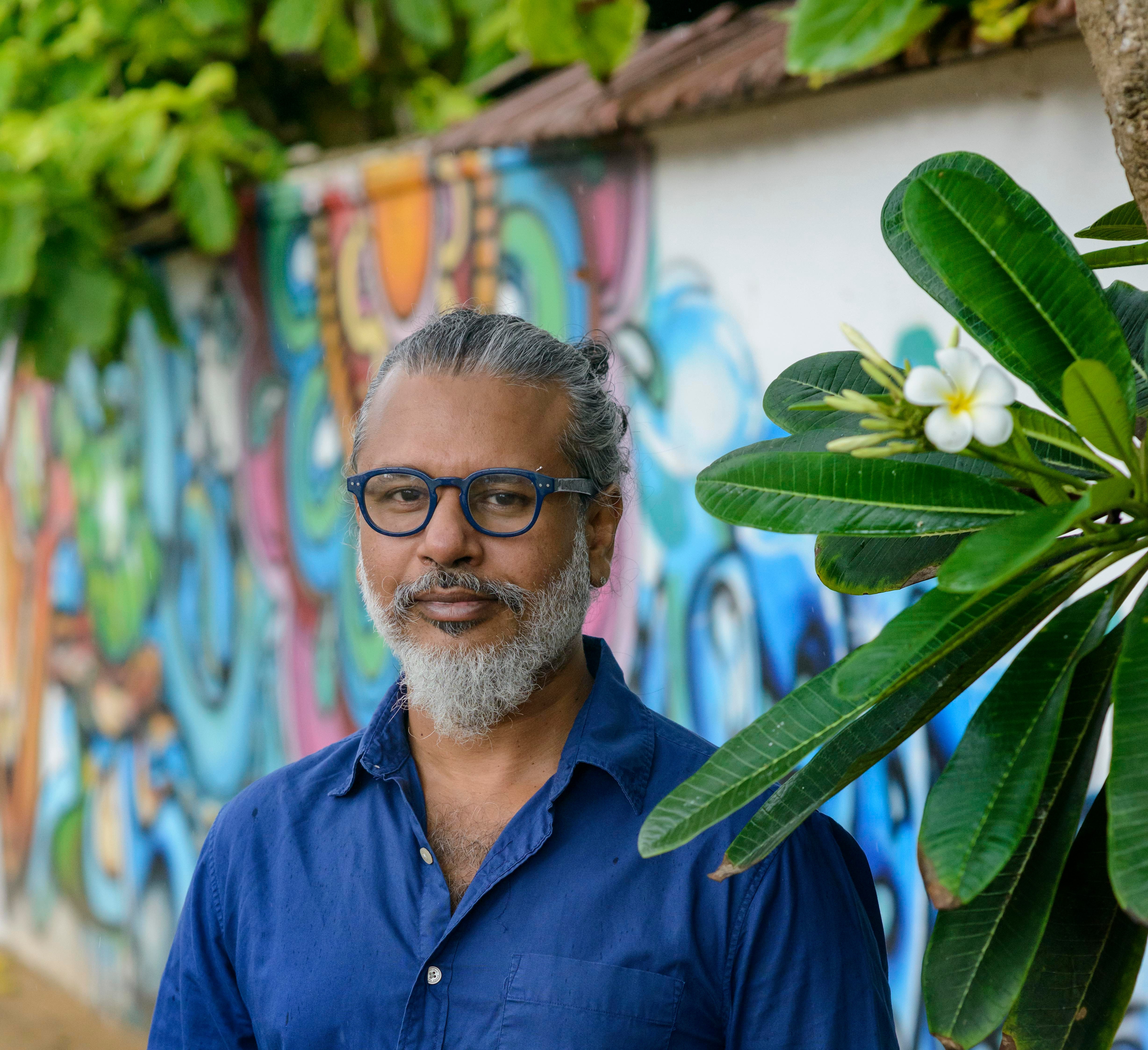 A person with a beard and glasses