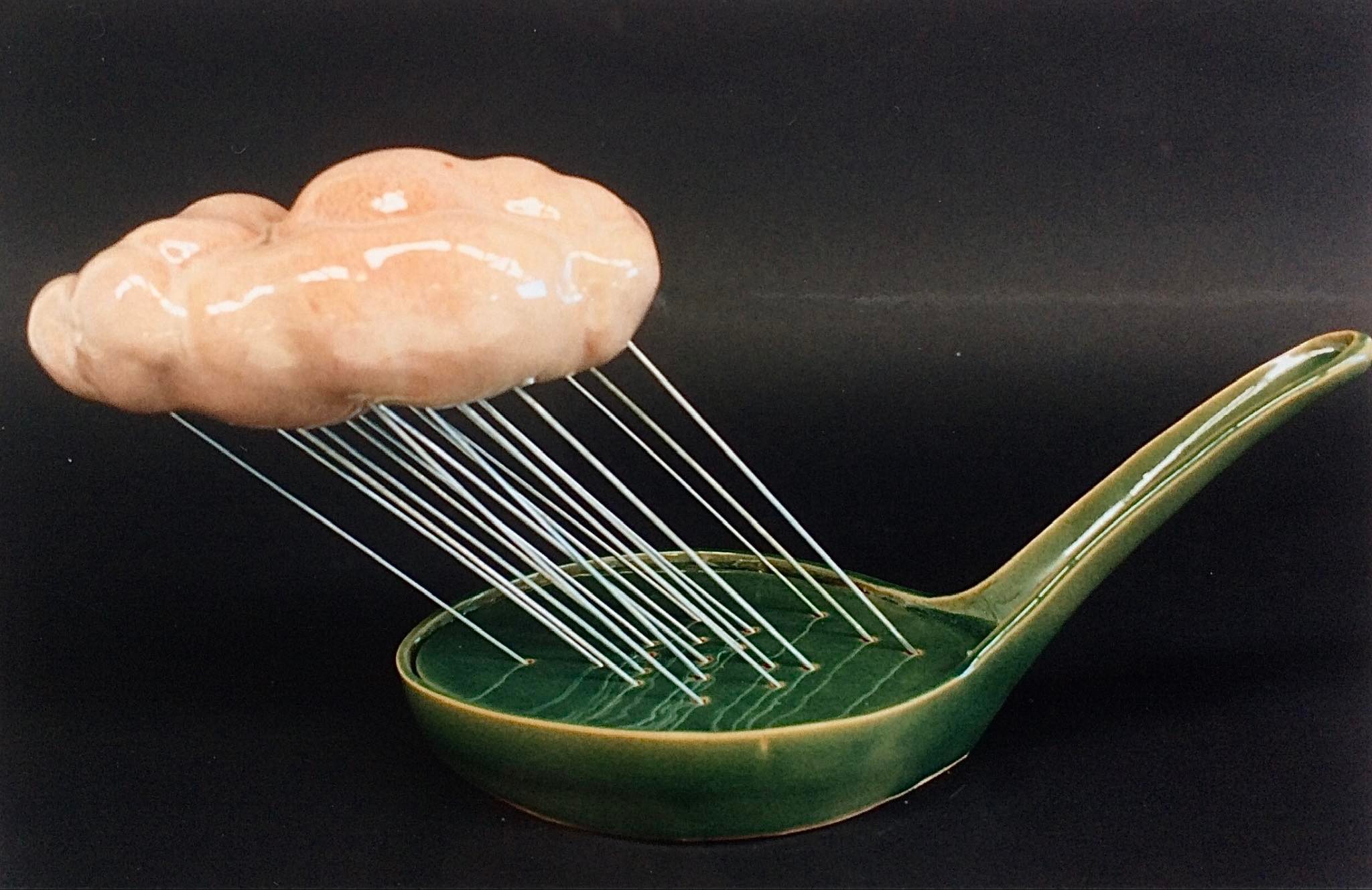 Ceramic East Asian-style soup spoon with a cloud above attached to it